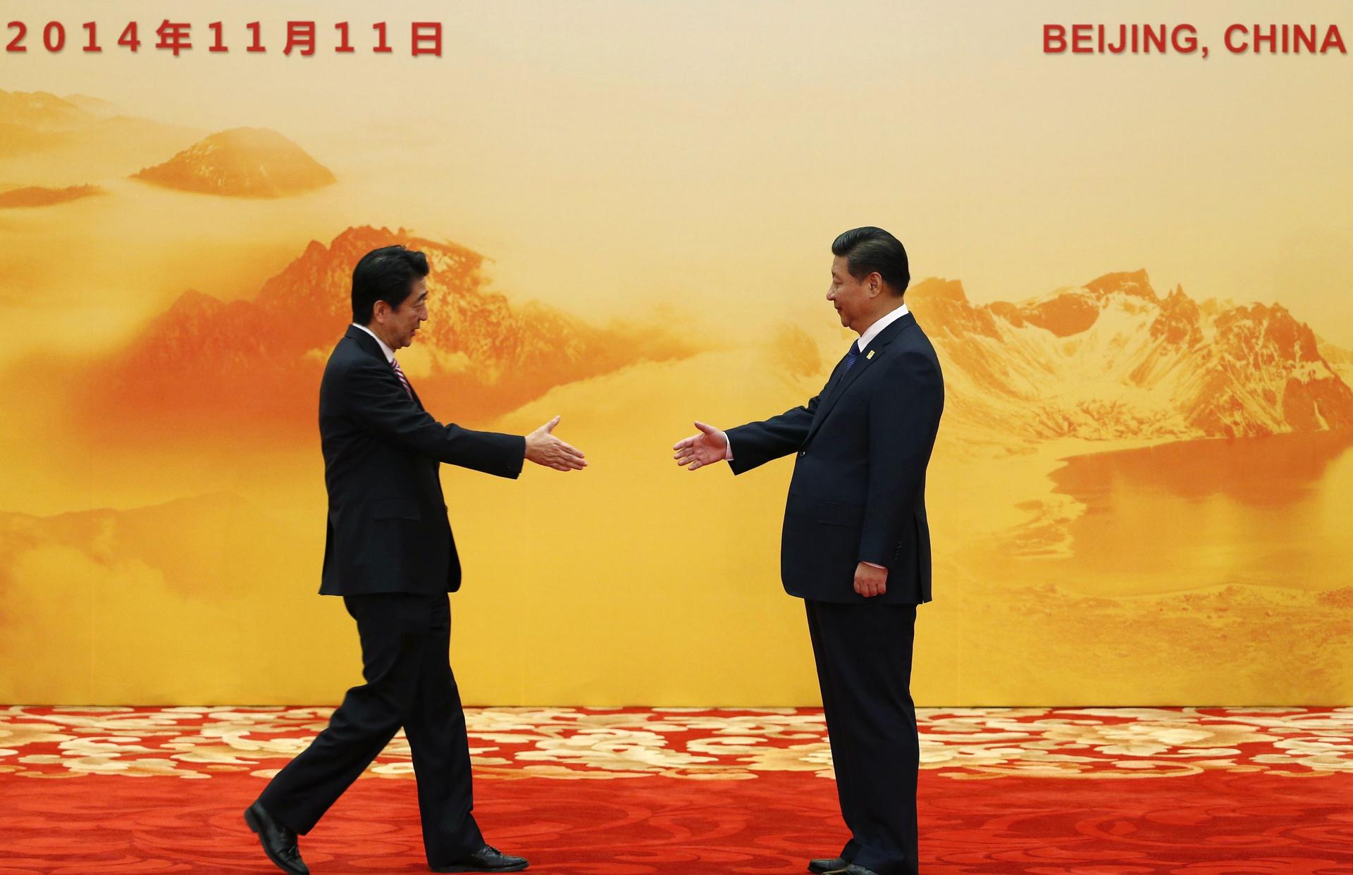 Abe and Xi reach out at Apec