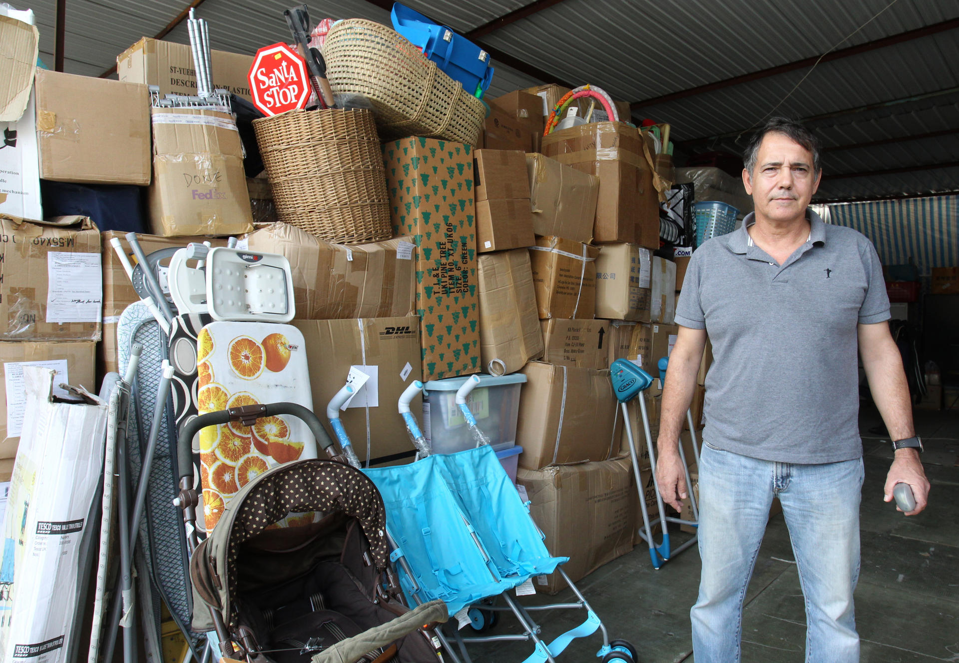 Remar's John Silva uses the organisation's truck to gather old furniture before restoring and selling them. Photo: May Tse