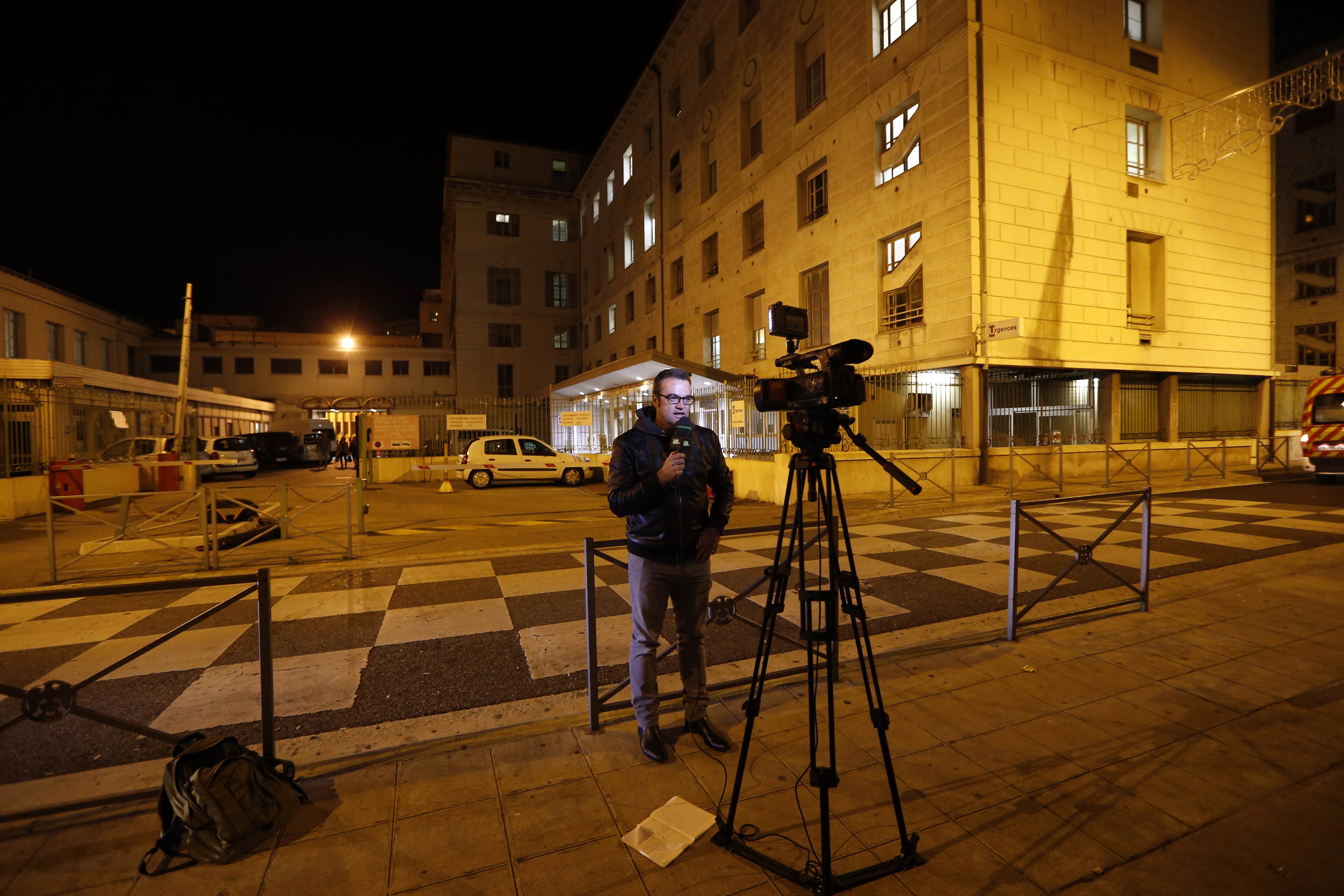A television reporter files a story from outside the hospital in Nice to where Bianchi has been moved. Photo: AFP