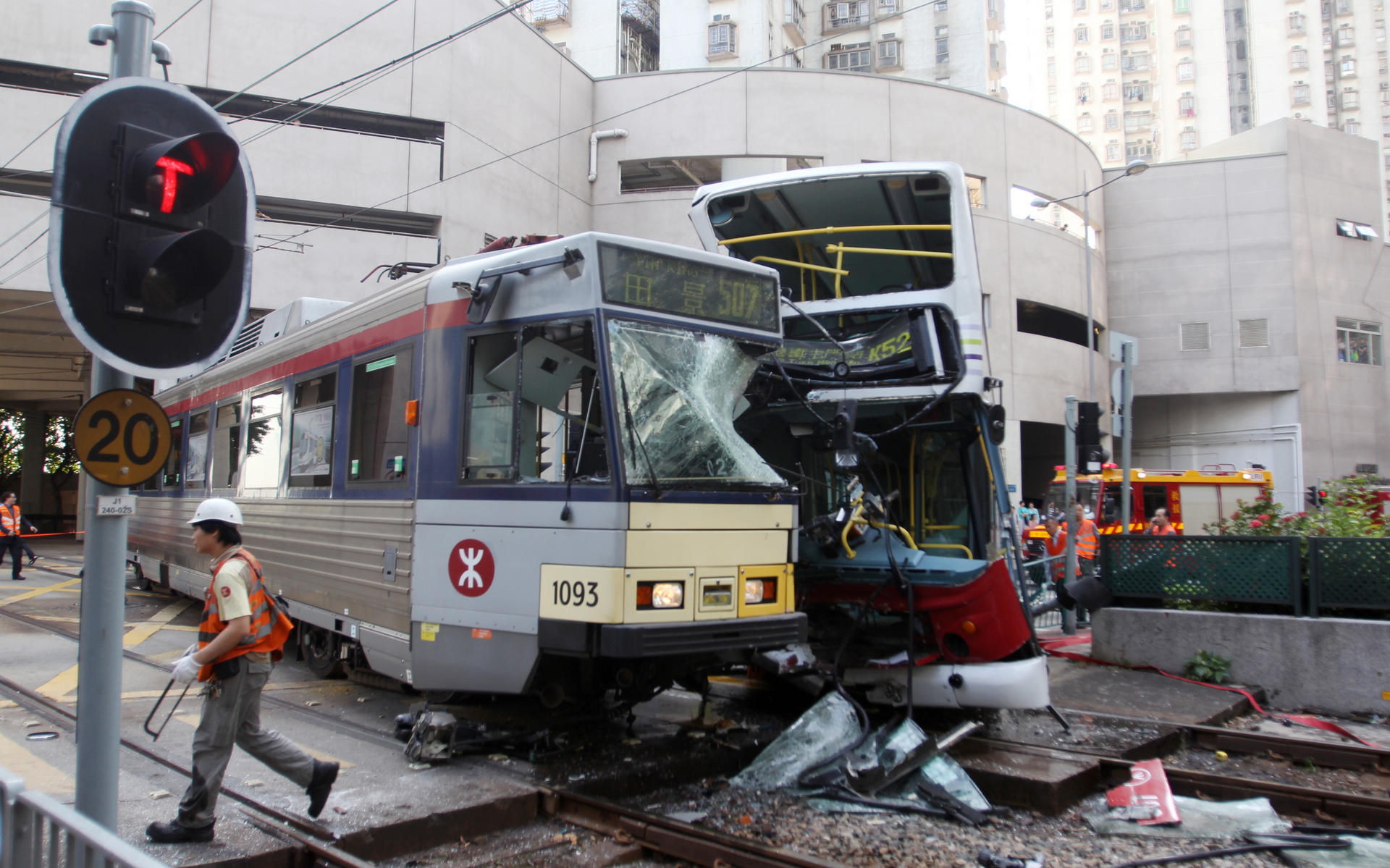 Nineteen people were taken to hospital after the light rail train and a double-decker bus were involved in a collision in Tuen Mun yesterday. Photo: SCMP pictures