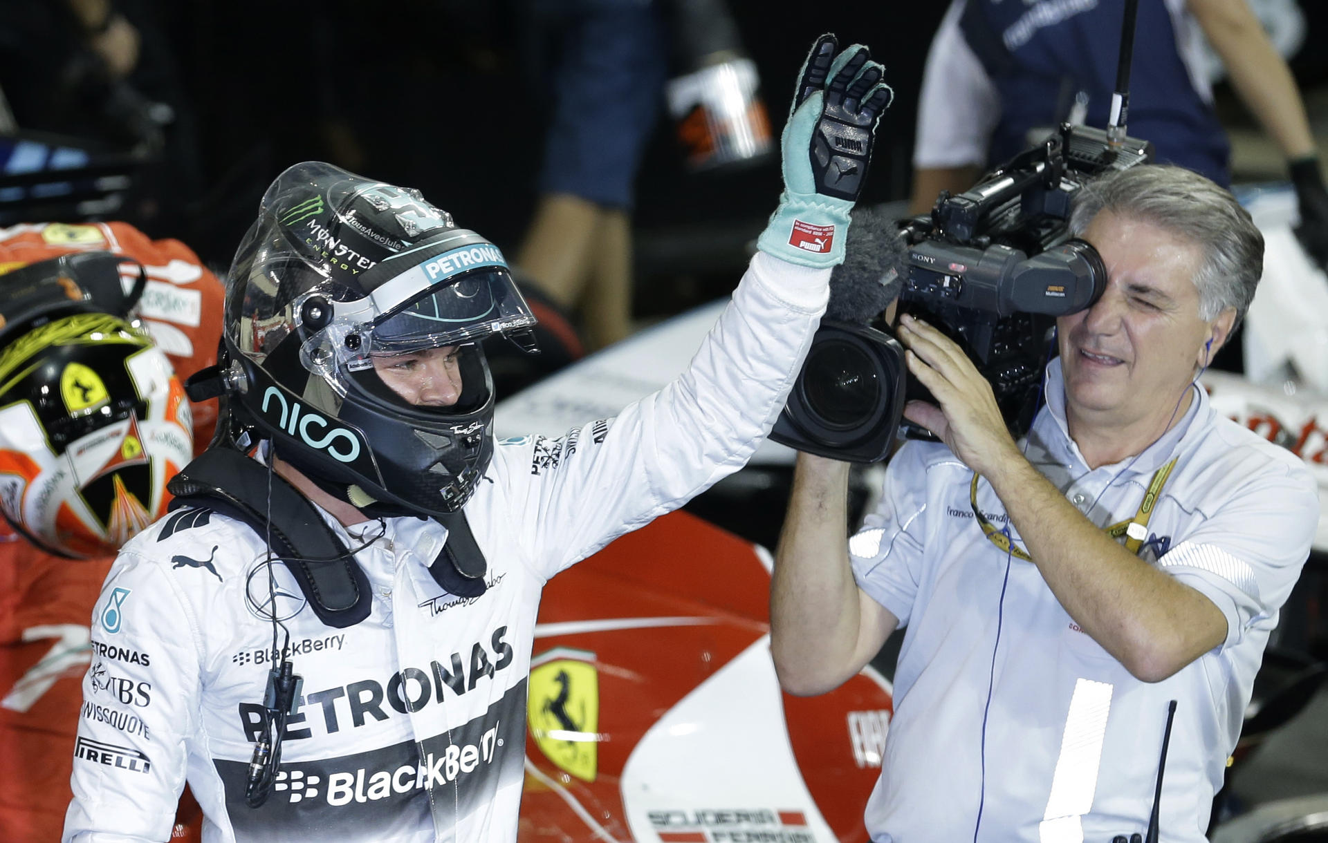 Mercedes driver Nico Rosberg waves to fans after capturing his 11th pole in the season-ending race at the Yas Marina track. Photo: AP