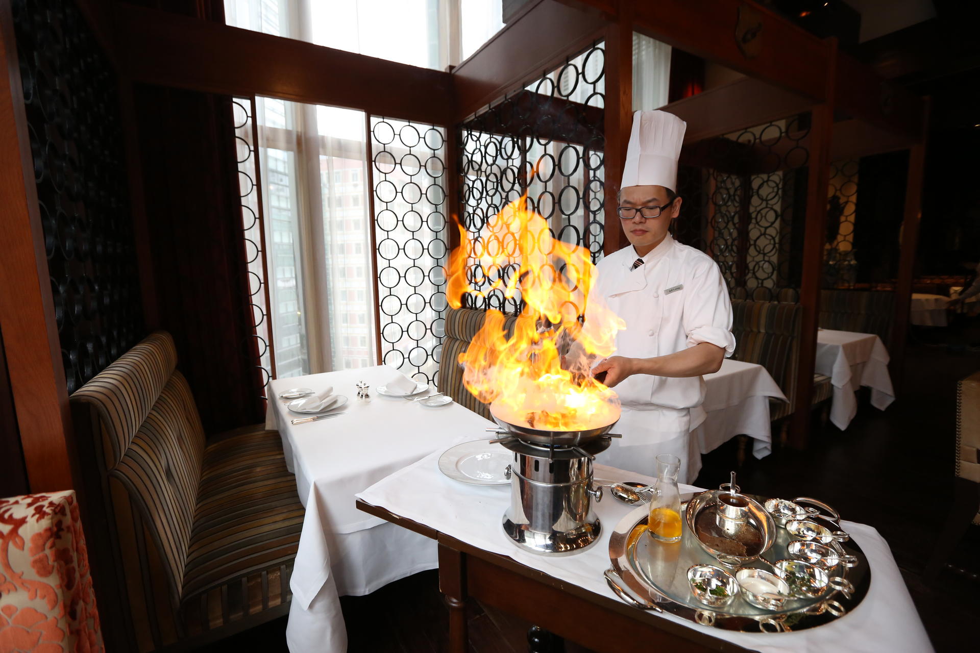 Sous chef Jeff Leung  flambées at the table. Photos: Nora Tam, SCMP