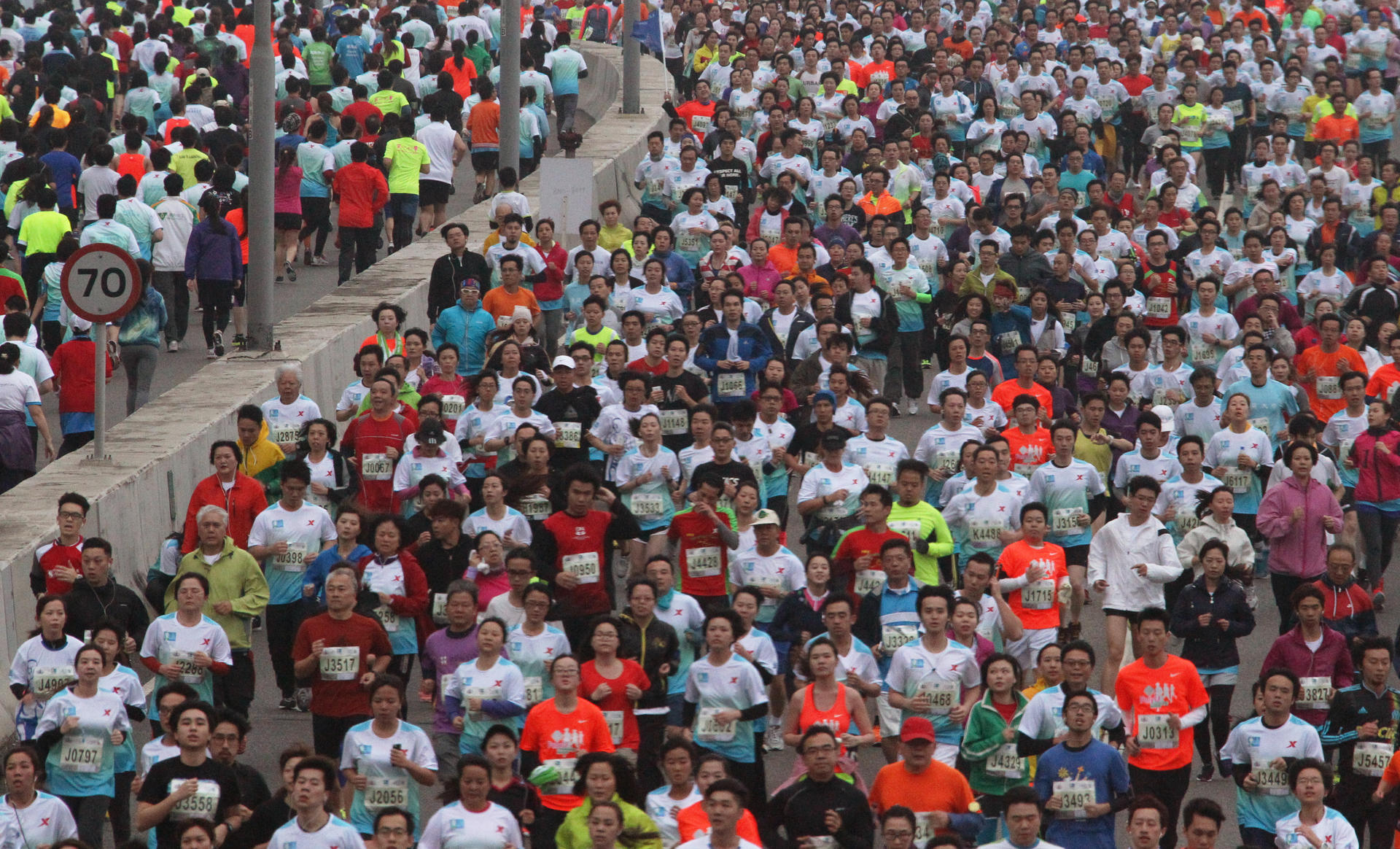 Maximum capacity: Thousands of runners head along the Eastern Corridor expressway during the 10km race as part of the Hong Kong Marathon. Photo: Felix Wong