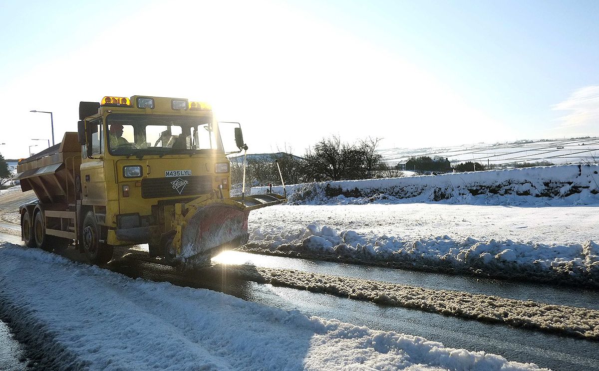 A snow plough clears a road near Sheffield, Yorkshire in northern England on Saturday. Photo: Reuters