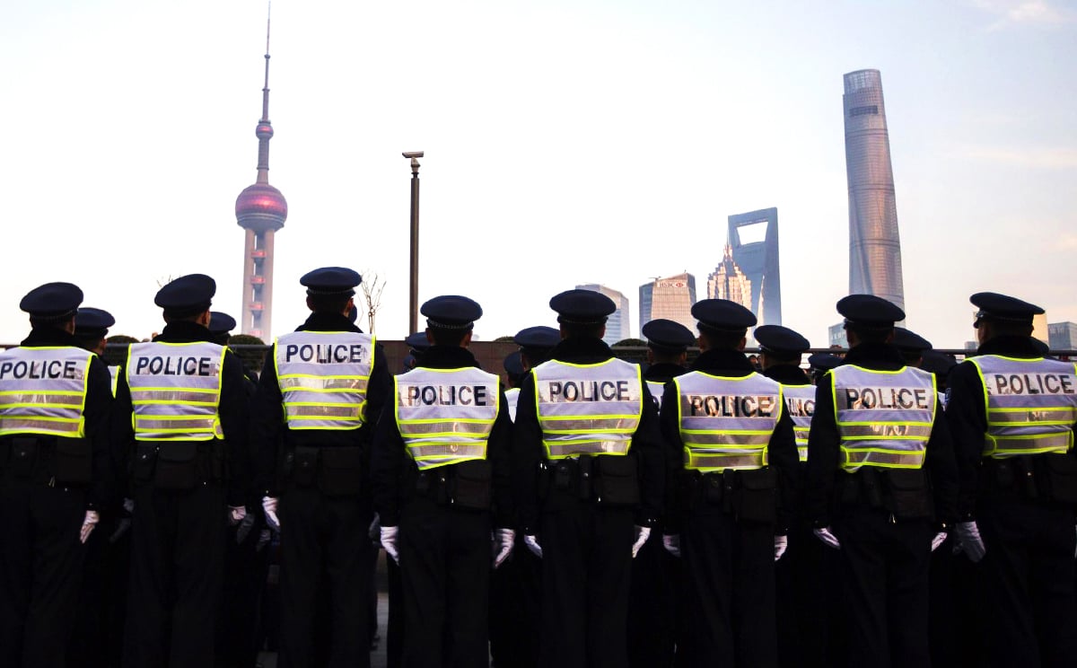 Policemen guard the Bund in Shanghai, where 36 people died in a stampede last week. Photo: Reuters