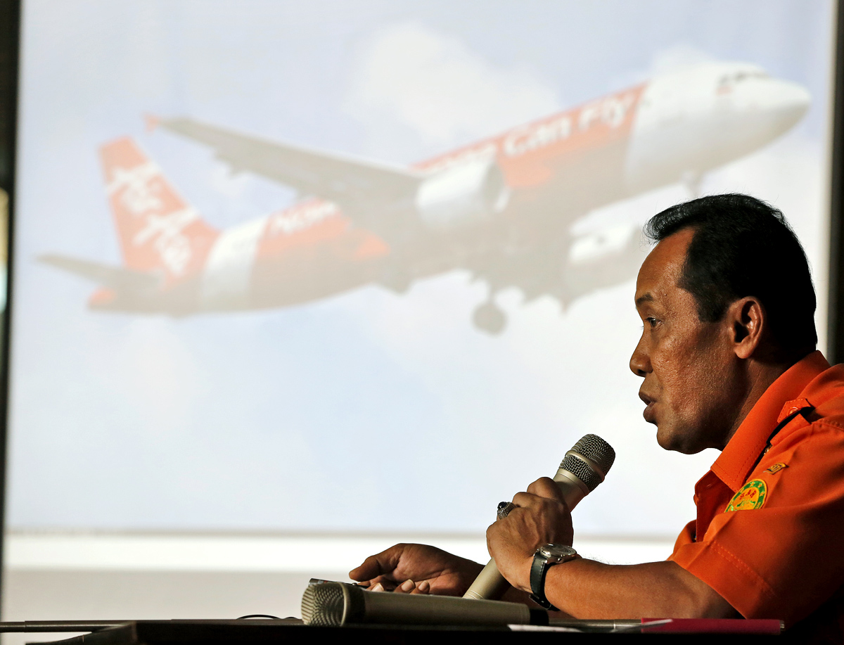 Indonesia's National Search And Rescue Agency chief Henry Bambang Soelistyo gives a briefing on the downed aircraft. He says the wrecked tail section will be lifted once the black boxes are found. Photo: AP