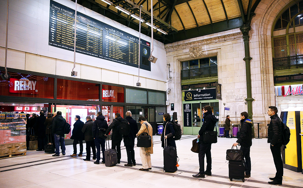 French commuters queue to buy the new edition of the satirical magazine Charlie Hebdo at Gare de Lyon train station in Paris on Wednesday. Photo: EPA
