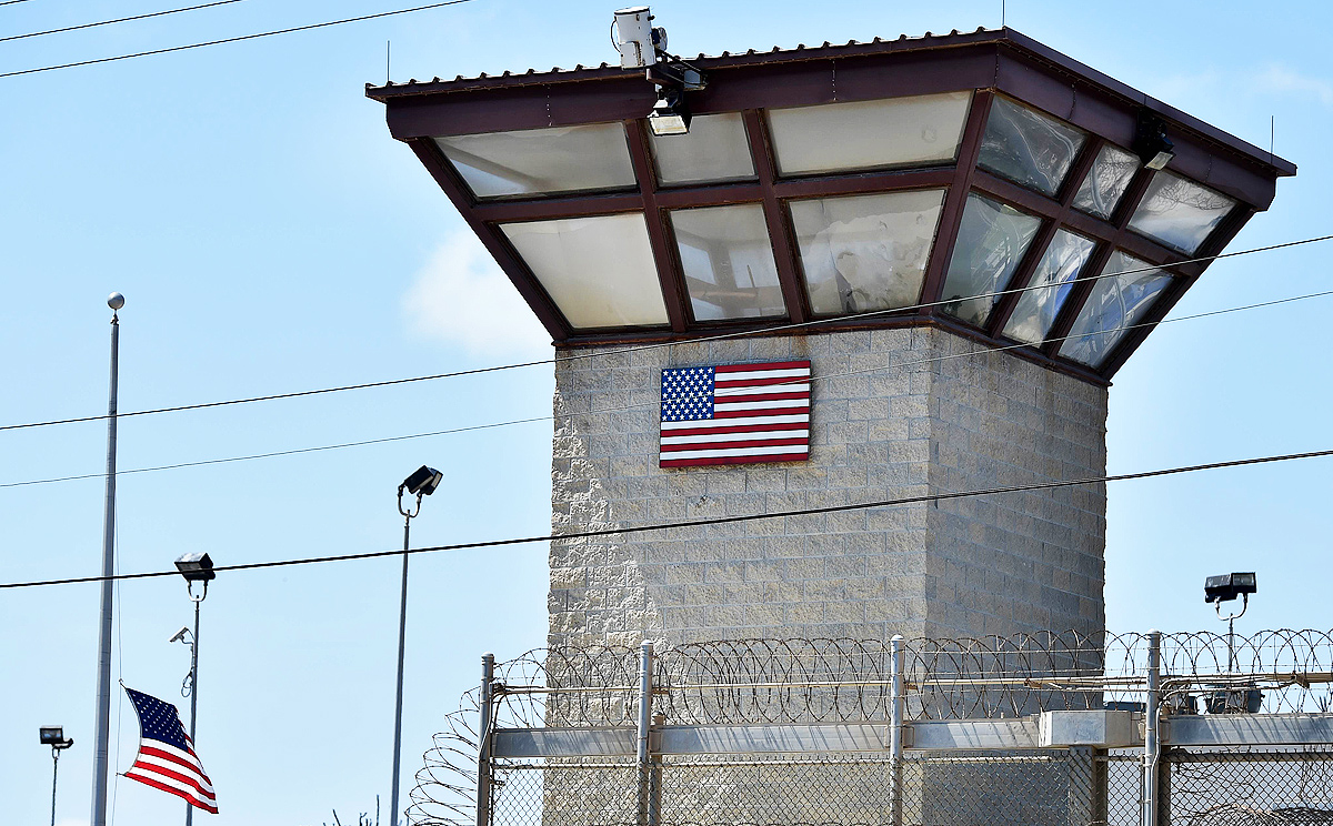 File picture reviewed by the US military shows the razor wire-topped fence and the watch tower of the detention facility at the US Naval Station in Cuba. Photo: AFP