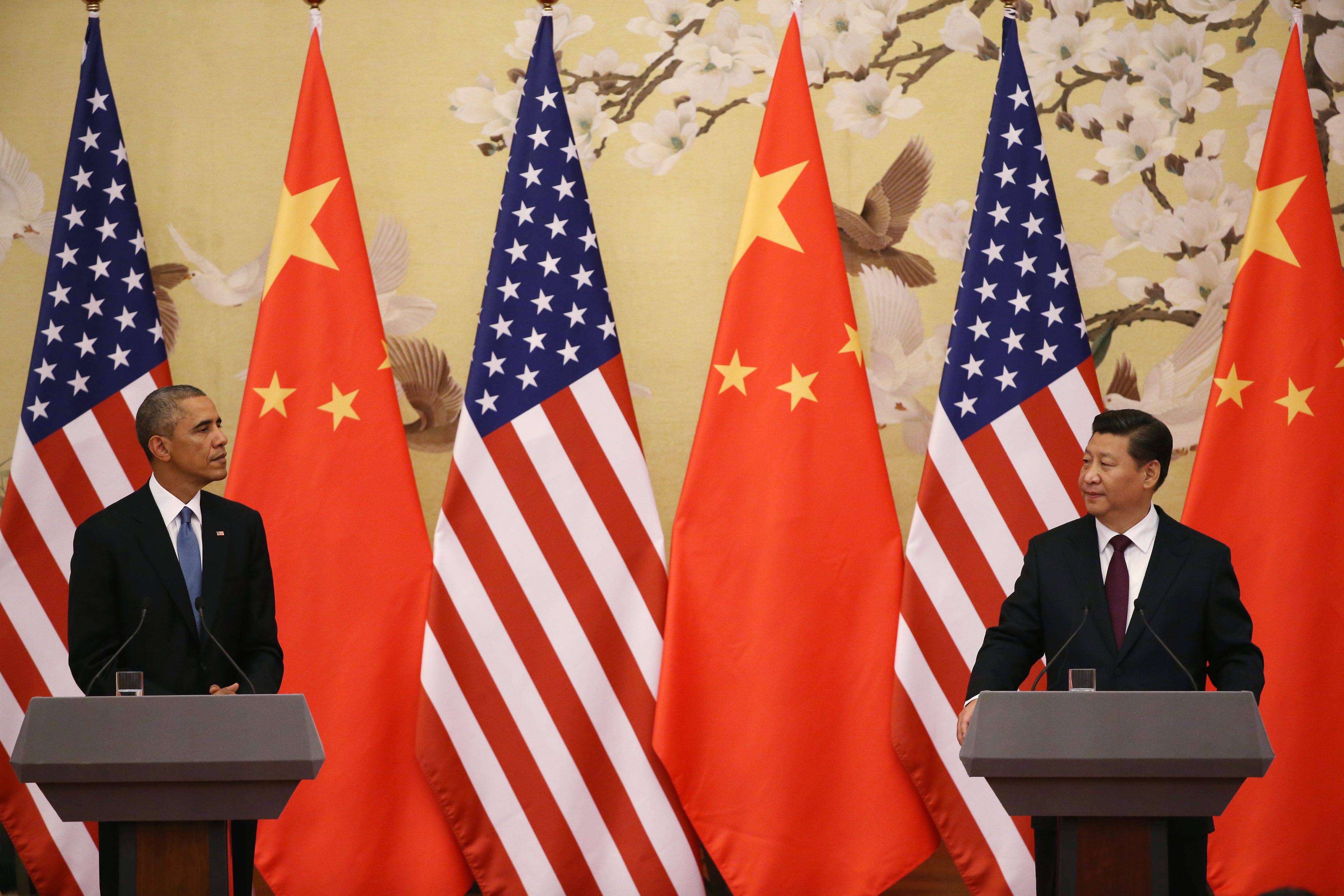 US President Barack Obama and Chinese President Xi Jinping hold a briefing at the Asia Pacific Economic Cooperation 2014 summit in Beijing. Photo: EPA