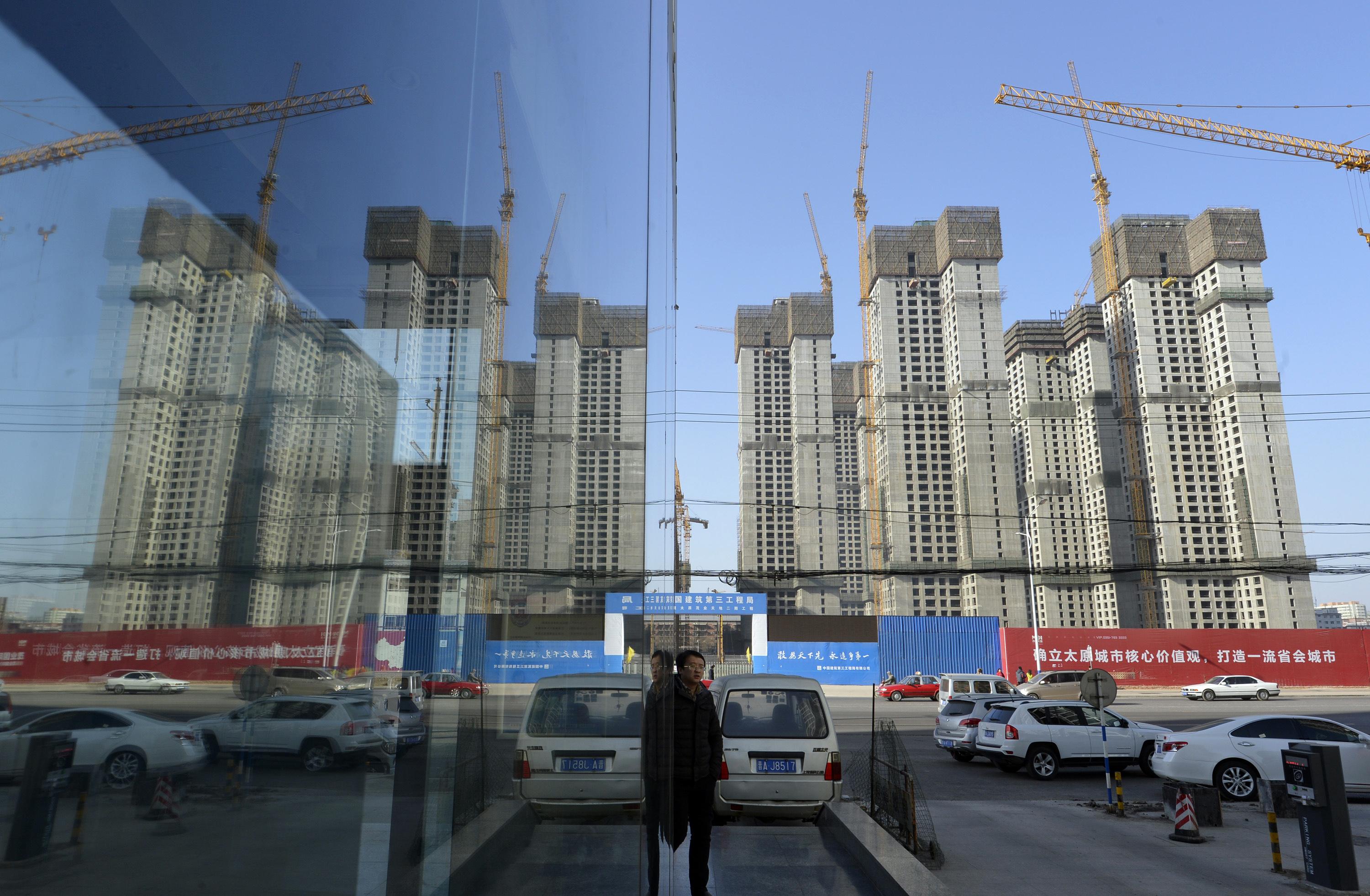 The ongoing hukou reform will help the urbanisation process and lessen the impact of the unfavourable demographic trend. Photo: Reuters