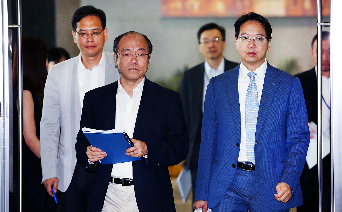 Lawmakers Ip Kin-yuen, Frederick Fung Kin-kee, and Charles Mok, leave Central Government Offices (CGO), after a meeting in August 2014 with Liaison Office Director Zhang Xiaoming and Chief Secretary Lam Cheng Yuet-ngor, Tamar. Photo: Nora Tam