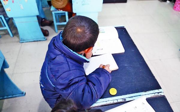 An eight-year-old boy has been living at a primary school in Henan after he was abandoned by his father in August. Photo: SCMP Pictures