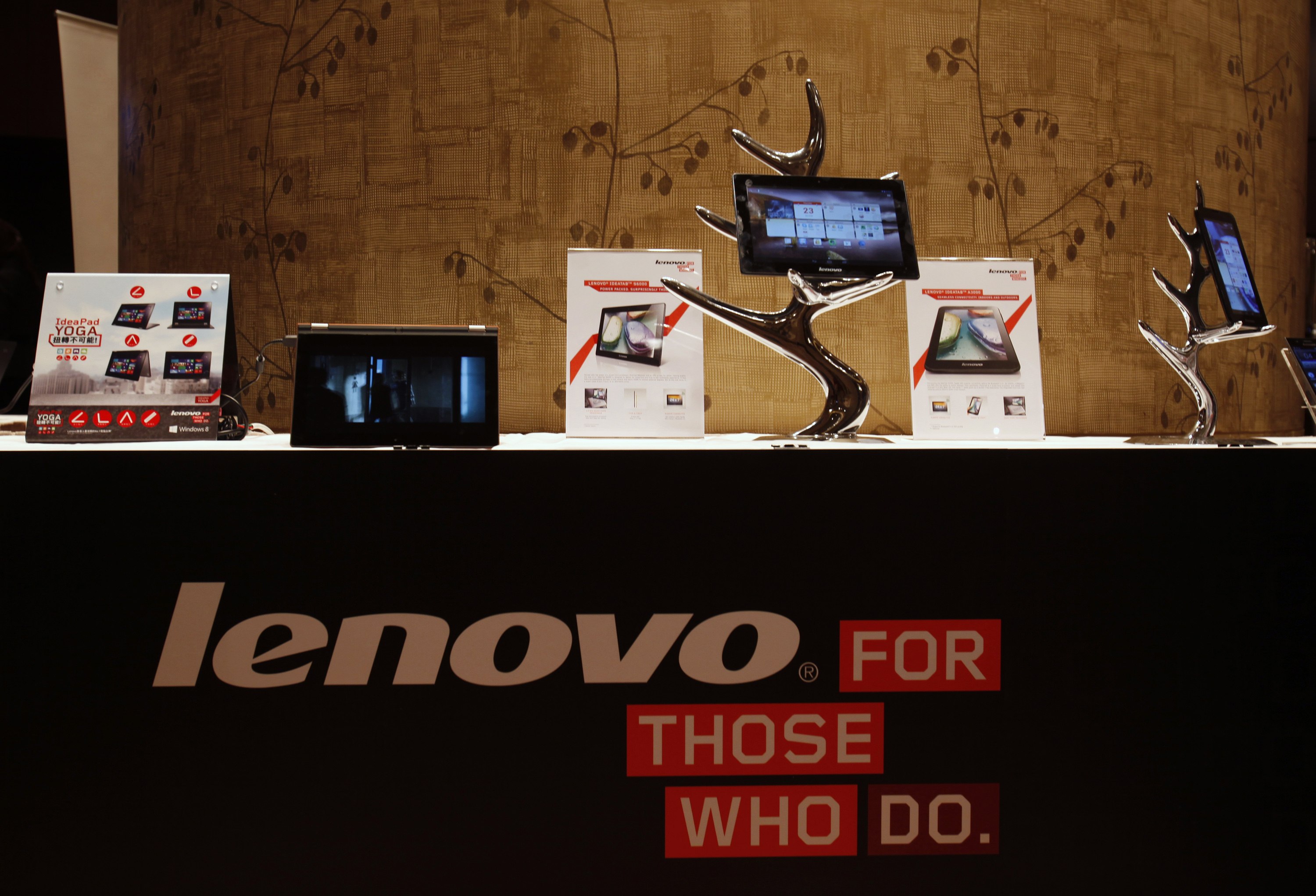 Lenovo tablets and mobile phones are displayed during a news conference in Hong Kong. Photo: Reuters