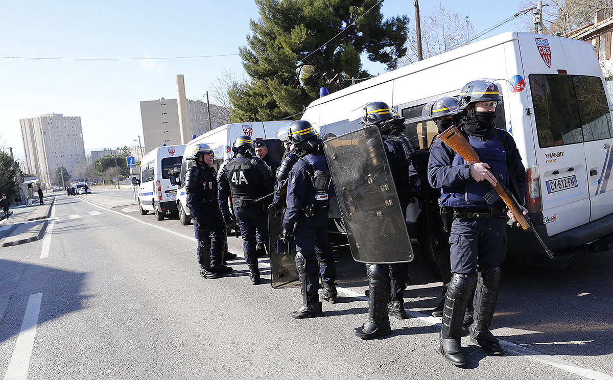Members of the National Security forces stand guard near La Castellane area of northern Marseilles. Photo: EPA