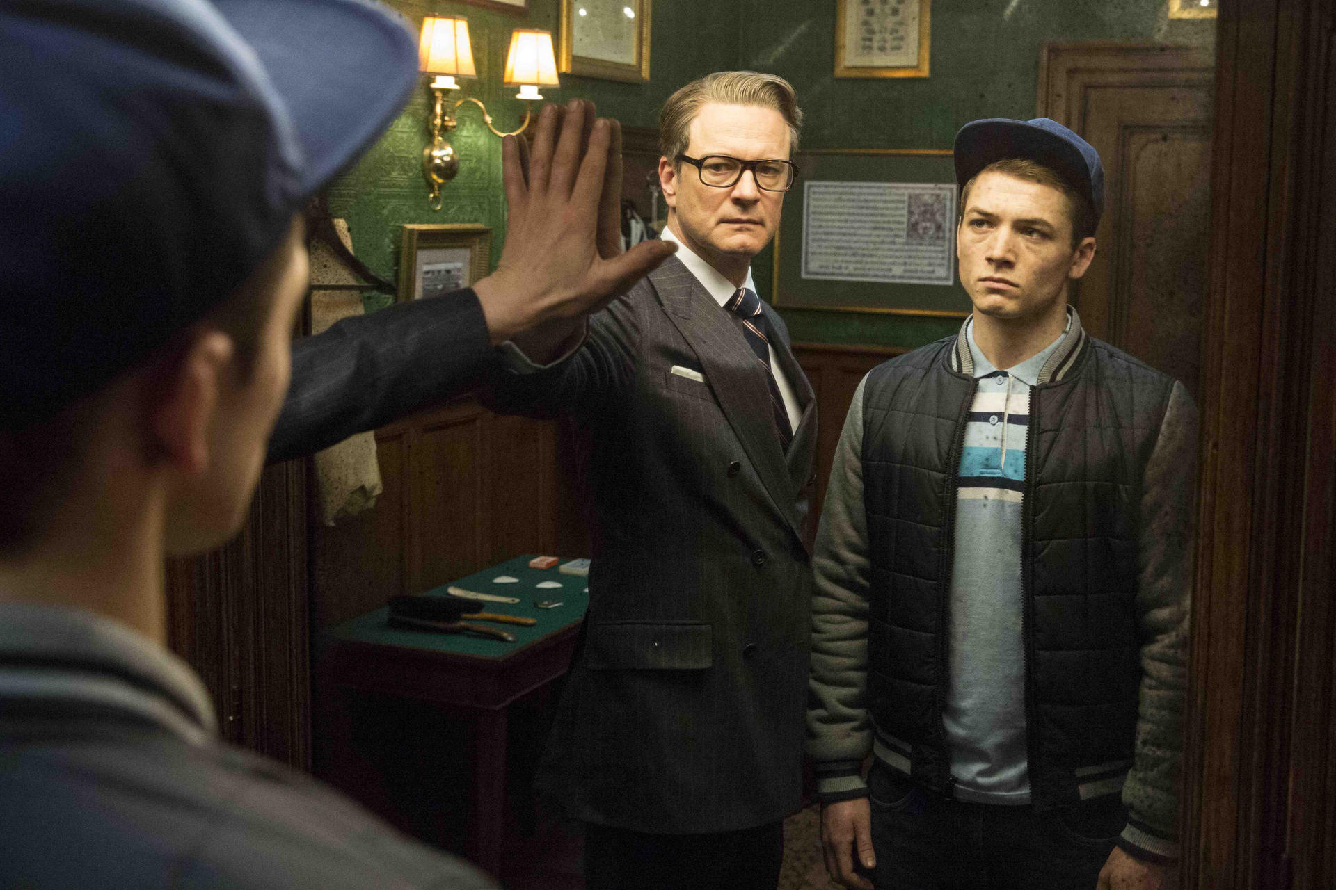 Colin Firth with Taron Egerton in a scene from Kingsman: The Secret Service.