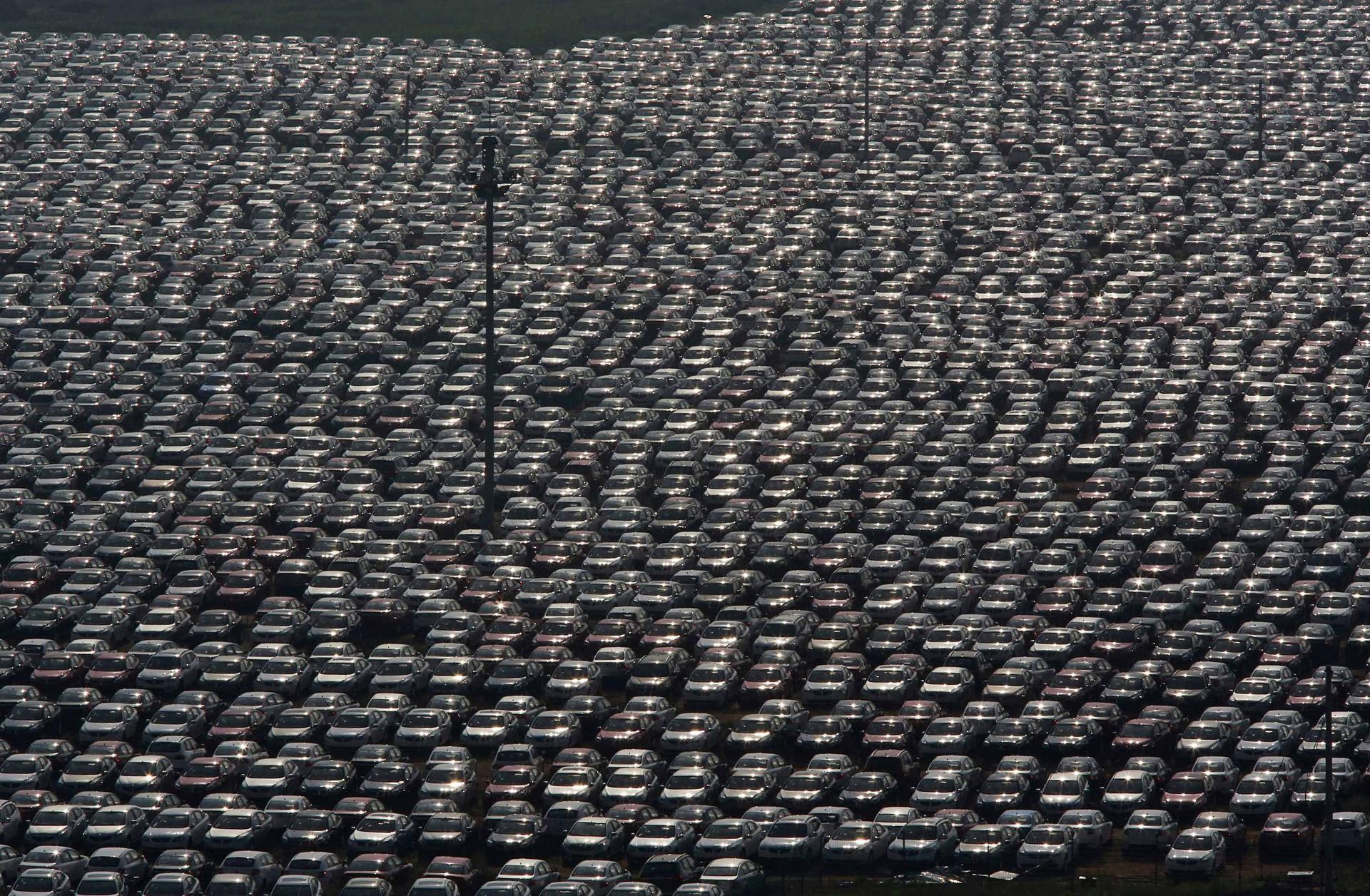 New vehicles parked at a factory in Shenyang, Liaoning province. There were 123 car production plants last year, and the number is expected to rise to 140 by 2017. Photo: Reuters