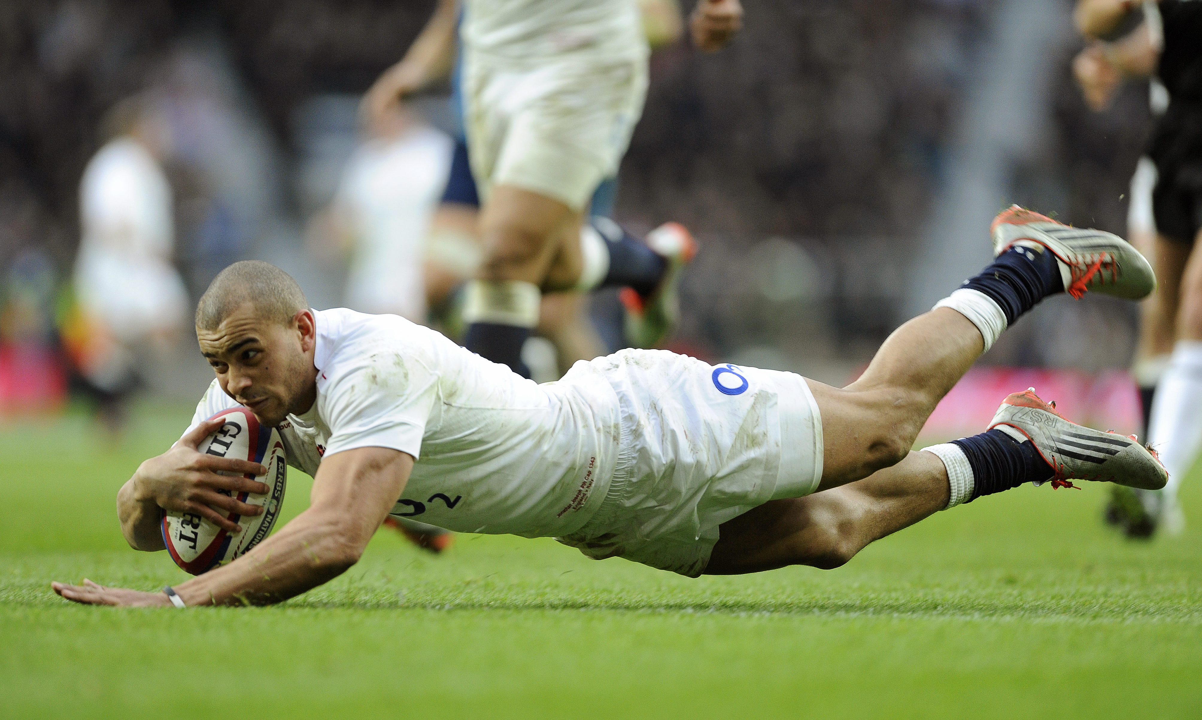 Jonathon Joseph scores one of his two tries in England's Six Nations match against Italy at Twickenham on Saturday. England won 47-17. Photo: EPA