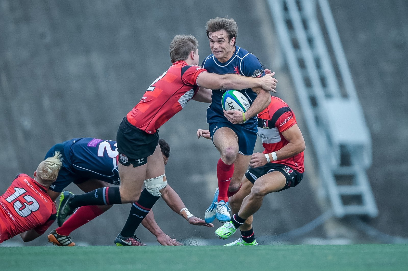 Hong Kong Scottish fullback Andrew Henderson tries to split the Valley defence in their Grand Championship semi-final at Shek Kip Mei. Photos: HKRFU