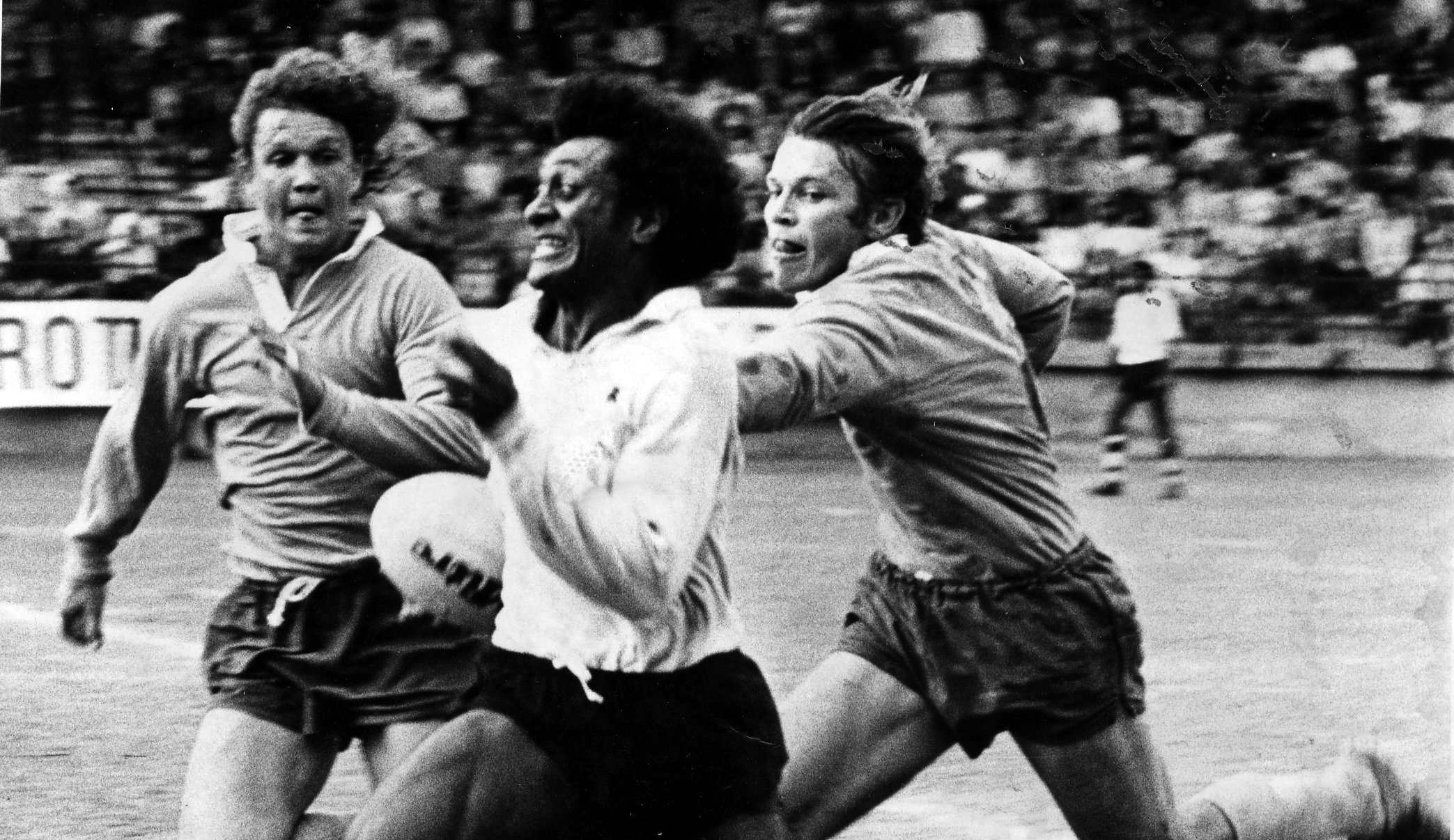 PHOTO 1: March 28, 1976 - Fijian winger Seremaia Tui Cavuilati heads for the line pursued by Gary Thomas (left) and Stephen Streeter in the semi-final against the Wallaroos of Australia. 