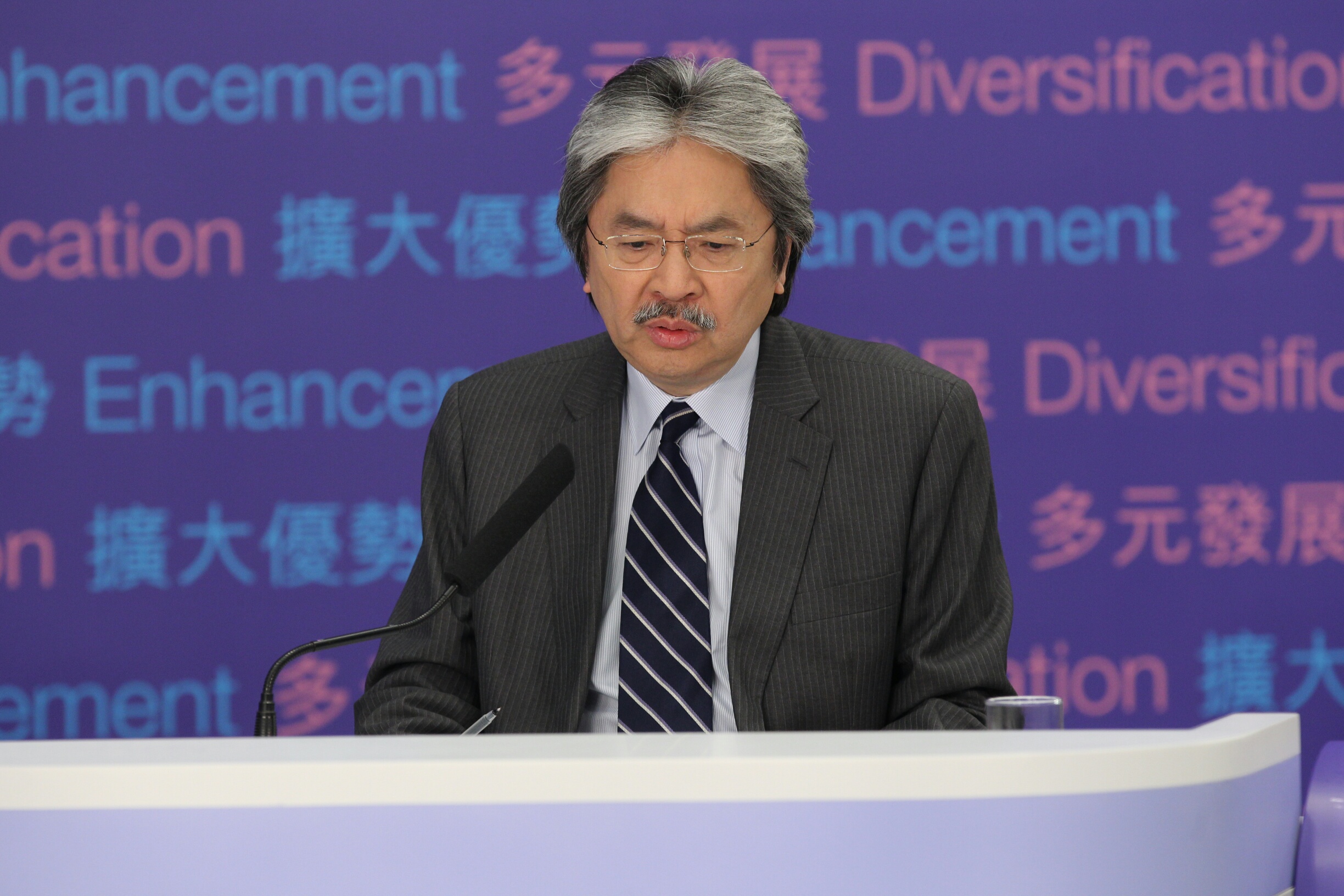 John Tsang took calls from the public about the budget on Thursday. Photo: Edward Wong