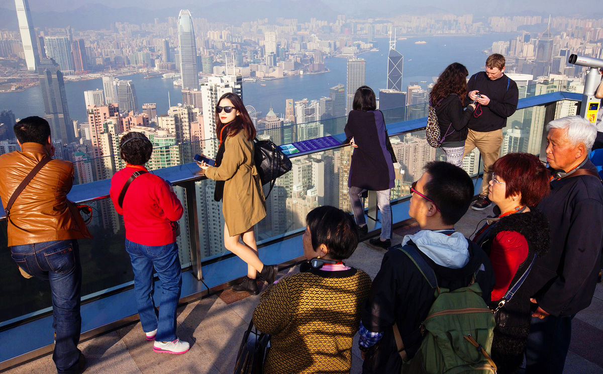 Tourists enjoy the views from The Peak. Over the Lunar New Year holidays, the number of mainland Chinese visitors to Hong Kong dropped 1 per cent year on year to 842,124. Photo: EPA