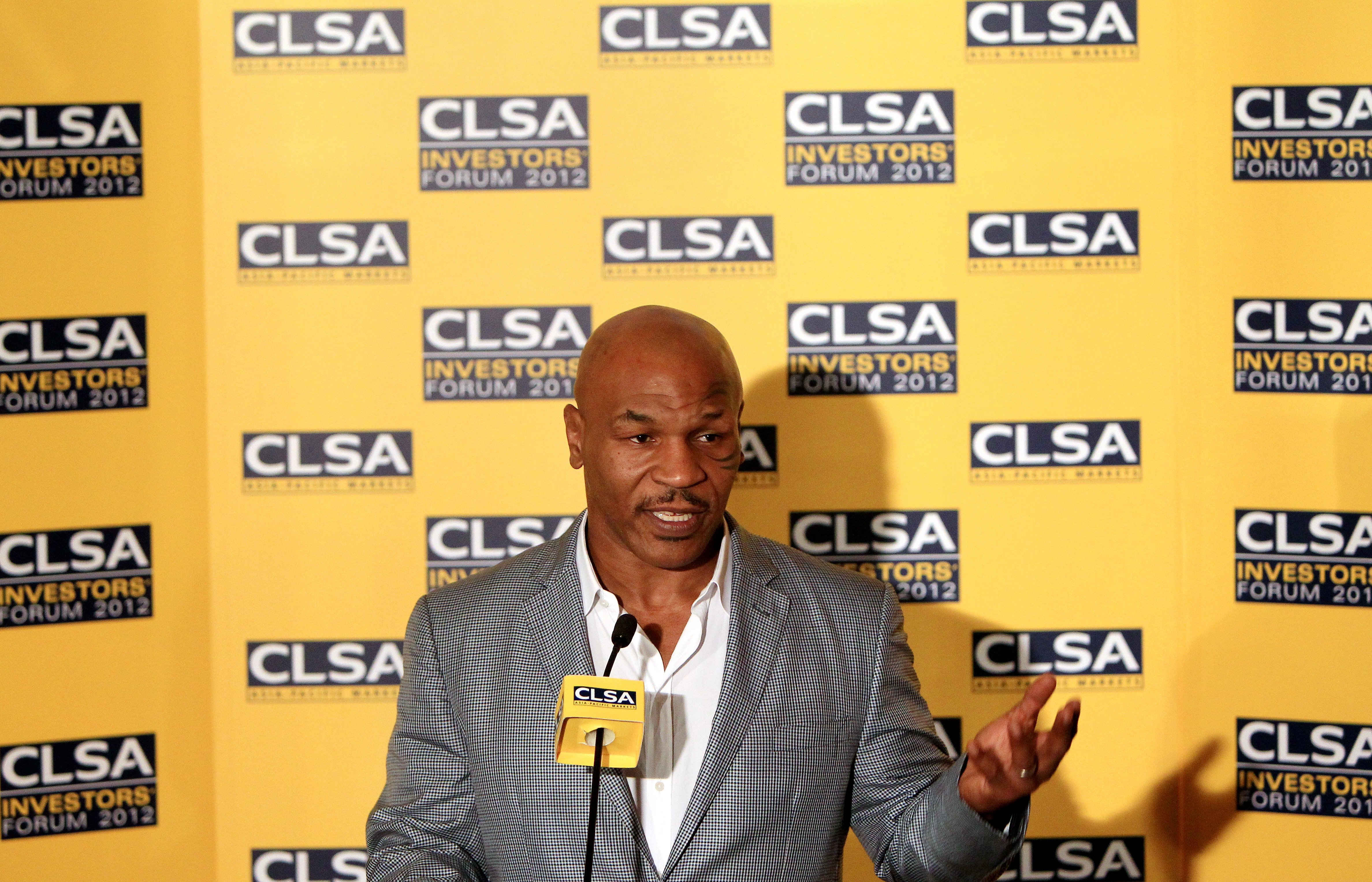 Former boxing heavy-weight champion Mike Tyson meets the press after speaking at a CLSA Investors' Forum. Photo: Jonathan Wong 