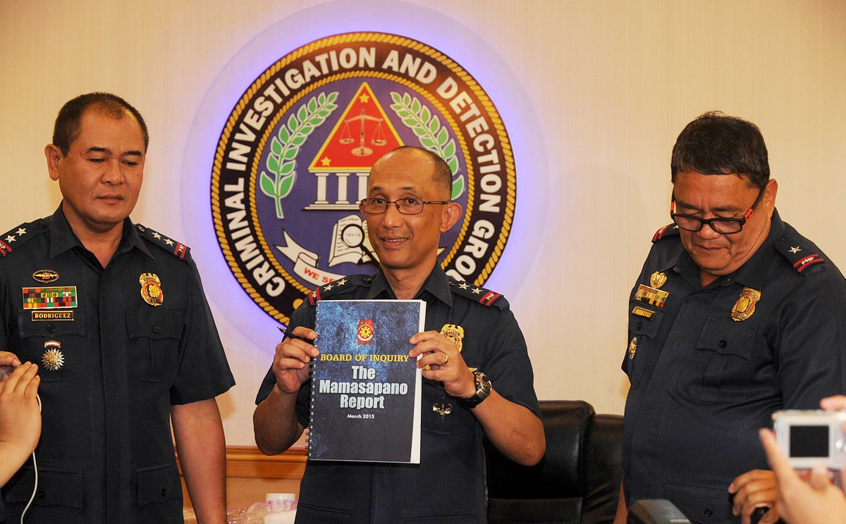 Police Director Benjamin Magalong (centre), flanked by Director Catalino Rodriguez (left) and Chief Superintendent John Sosito, holds a compiled report of the January 25 incident, where 44 police commandoes were killed during a mission against Muslim extremists, at the Philippines National Police headquarters in Manila. Photo: AFP