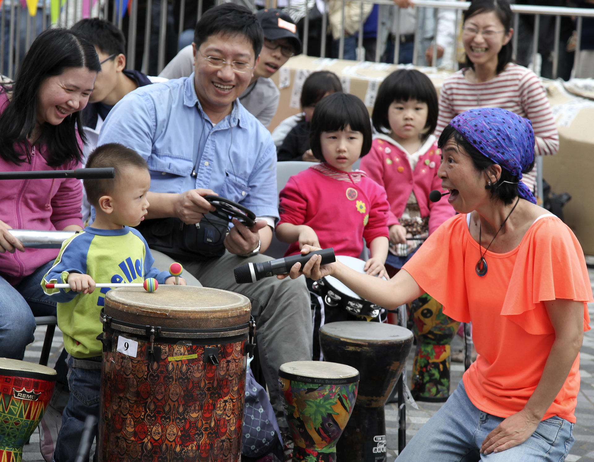 Kumi Masunaga introduces local families to the joys of Drum Jam. Photo: Danny Chan