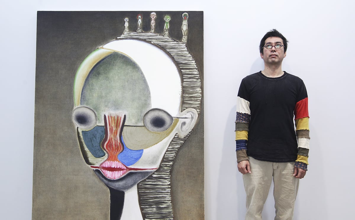 Japanese artist Izumi Kato with his artwork Untitled, 2013 at Galerie Perrotin in Central last year. Photo: Jonathan Wong