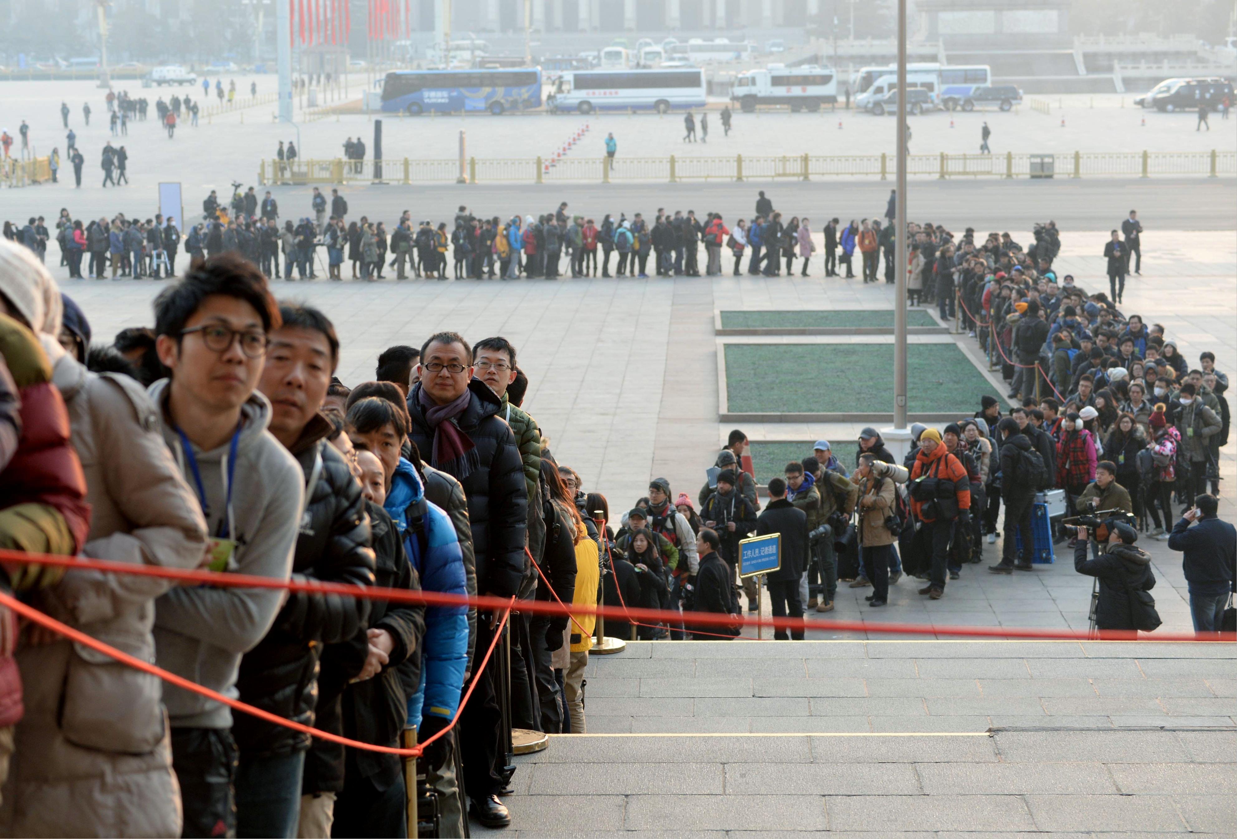 Reporters queuing to get into a National People's Congress session in Beijing. Photo: Kyodo. 