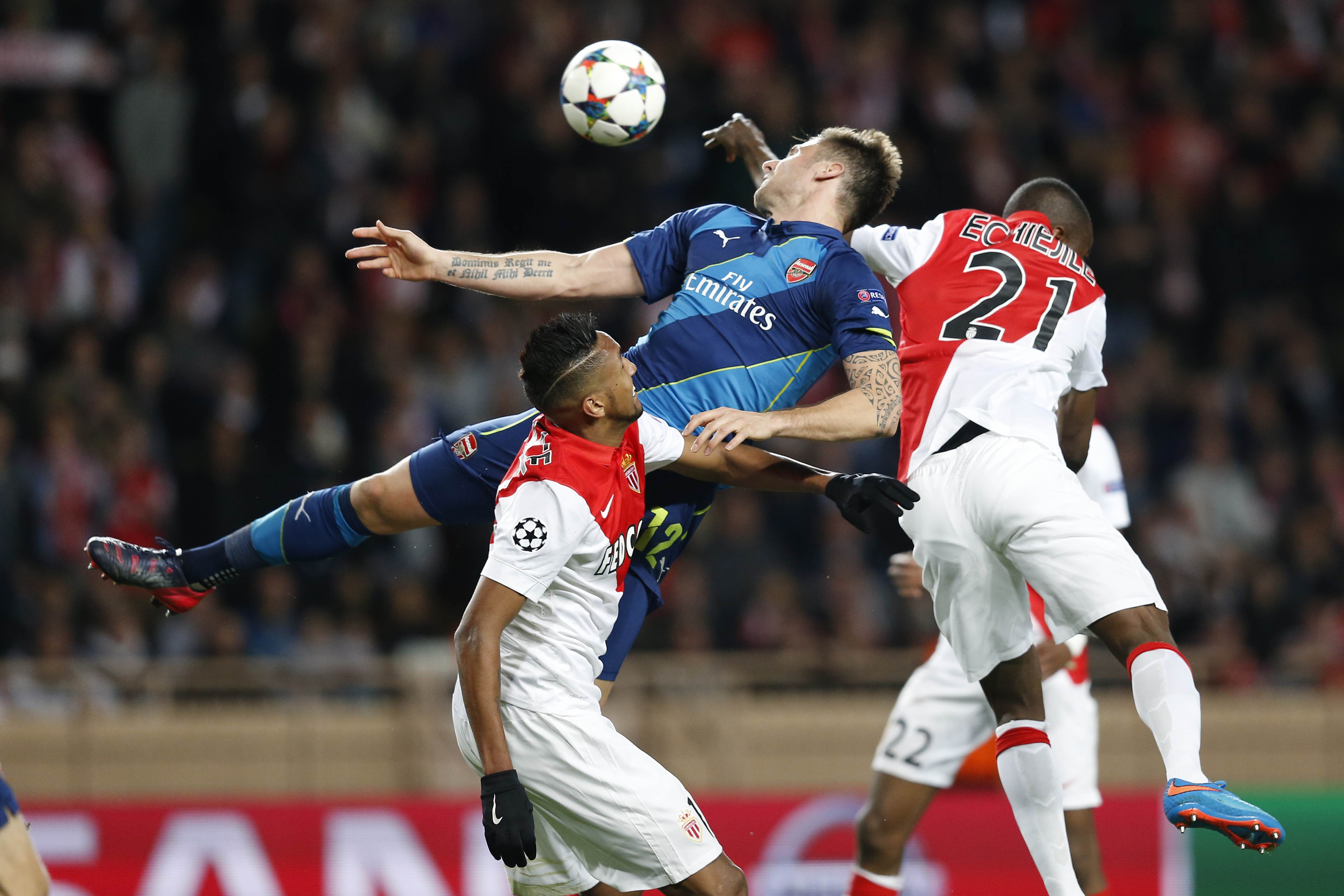 Arsenal's Olivier Giroud vies with Monaco's  Wallace in their  Champions League match  at Louis II stadium in Monaco. Photo: AFP
