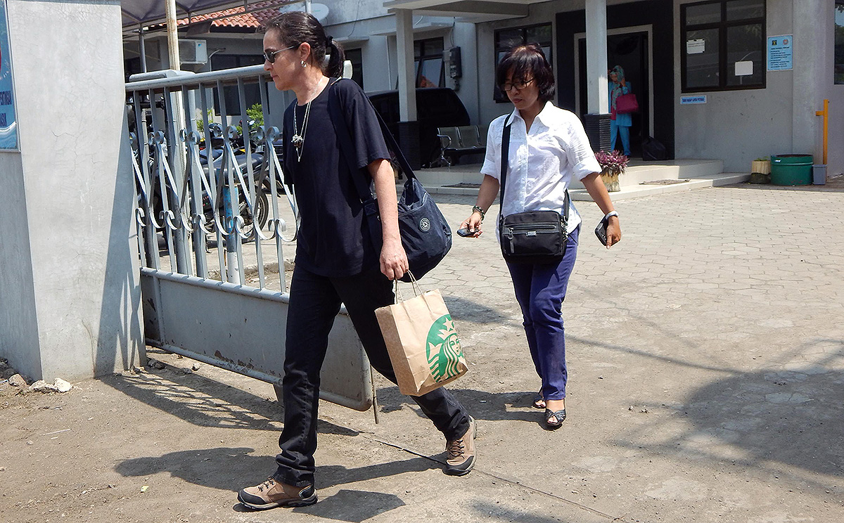 The cousin of Brazilian death row prisoner Rodrigo Gularte, leaves the outpost of Nusakambanga prison island, off central Java. An Indonesian court adjourned the latest legal bid by the two Australian drug smugglers, the ringleaders of the so-called "Bali Nine" drug trafficking gang. Photo: AFP