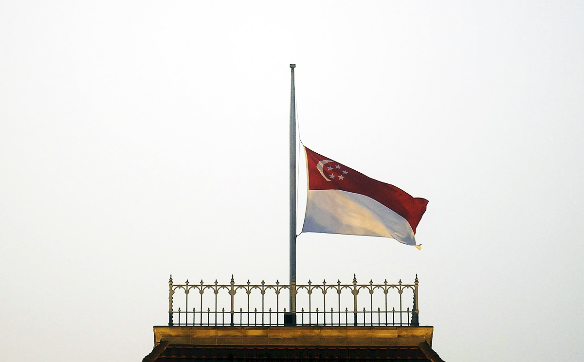 The Singapore flag flies at half-mast at Parliament House. Photo: Reuters
