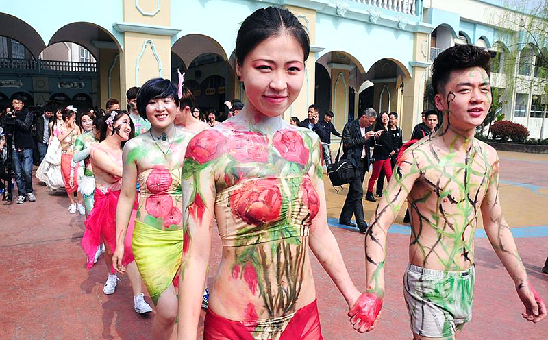 Couples stage 'naked weddings - covered in body paint and wearing only their underwear - at Hangzhou Paradise amusement park in Zhejiang province as a rejection of modern Chinese values, which places greater focus on money than love. Photo: SCMP Pictures