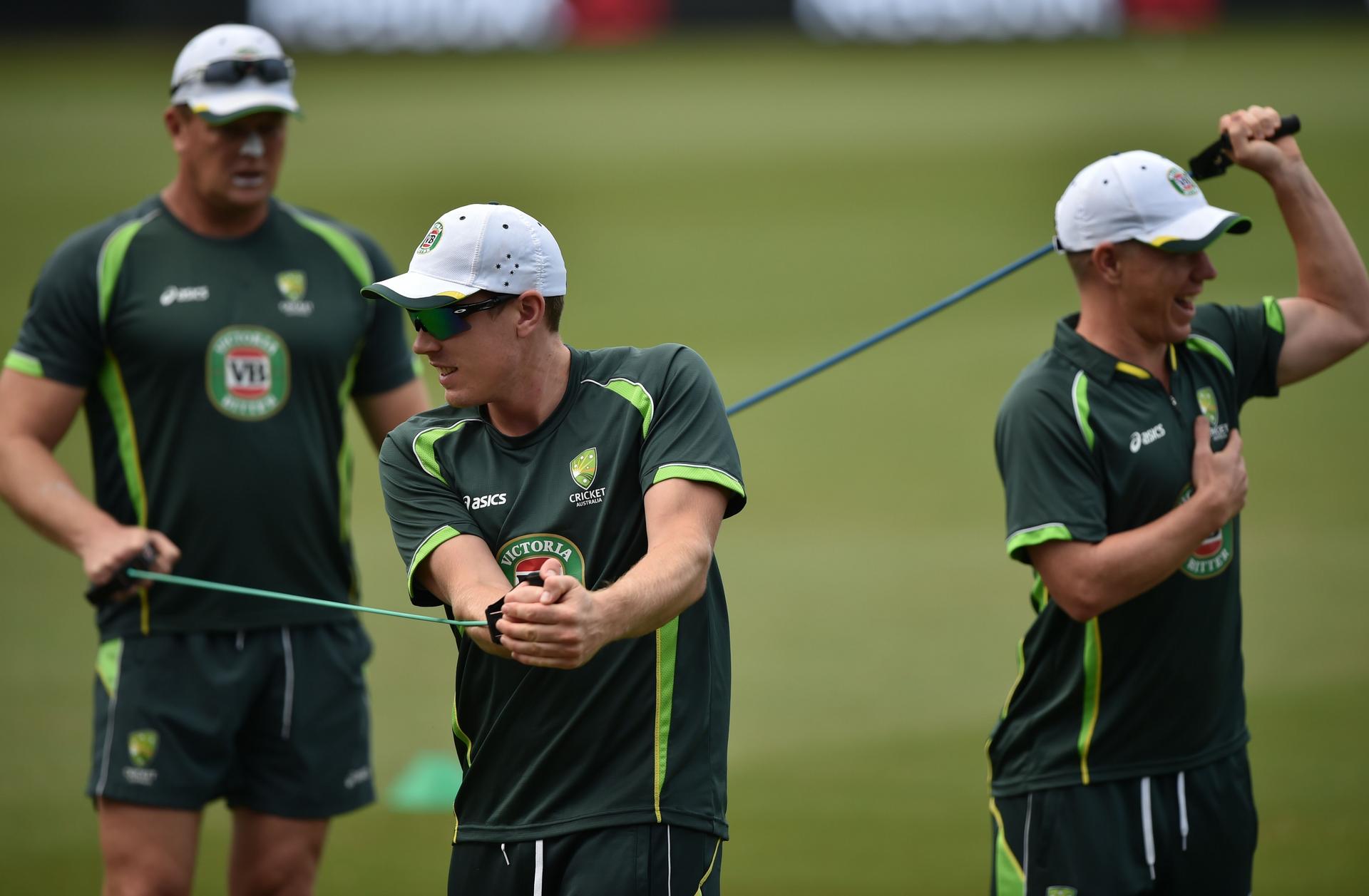 Australia players warm up at a training session in Sydney yesterday. Photo: AFP