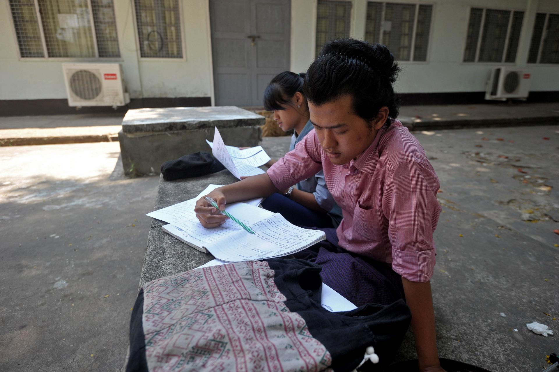 Students revise lessons at the University of Yangon, which reopened in 2013 as part of attempts to overhaul an education system that calcified under army rule. Photo: AFP