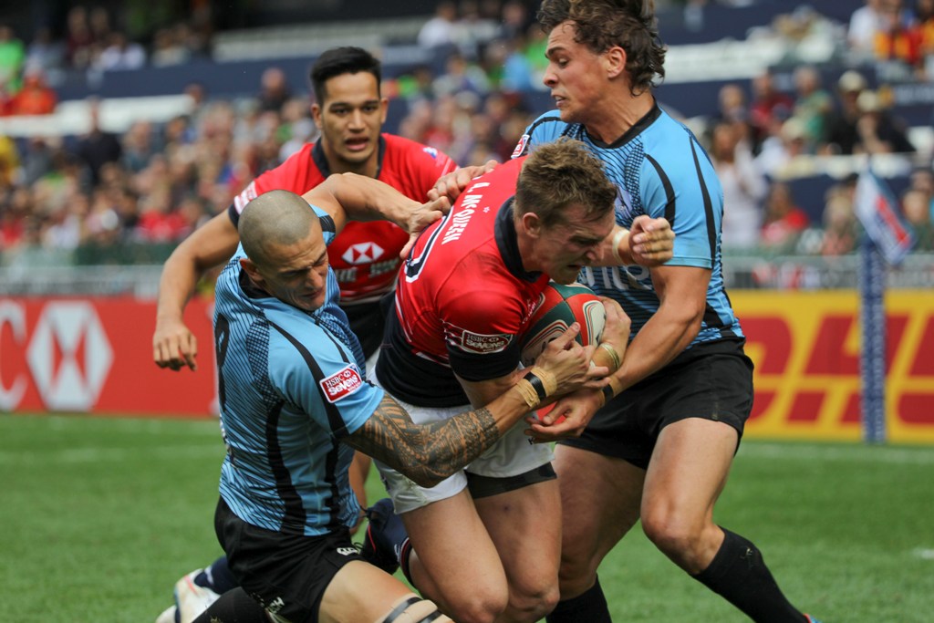 Hong Kong hero Alex McQueen forces his way through the Uruguay defence to score the second of his two tries in Saturday’s 19-7 pool victory. Photos: Nora Tam/SCMP