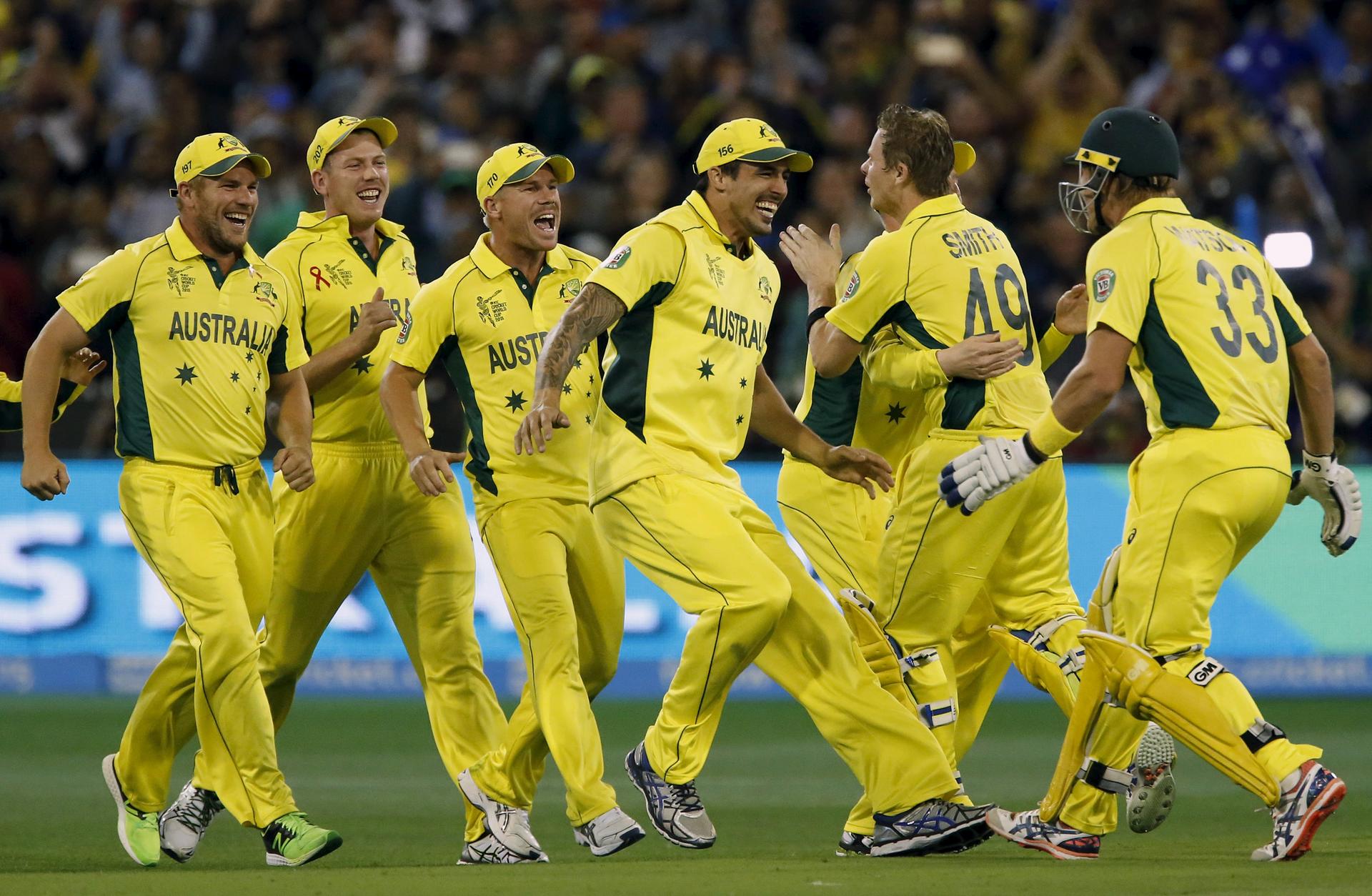 The smiles say it all as Australian players celebrate after defeating New Zealand in their Cricket World Cup final match at the Melbourne Cricket Ground in front of a record crowd. Photos: Reuters