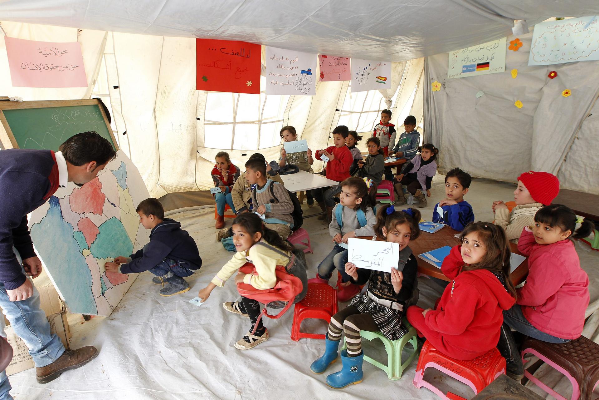 Syrian refugee children attend class at a Unicef school in the Bekaa Valley in eastern Lebanon. Photo: EPA