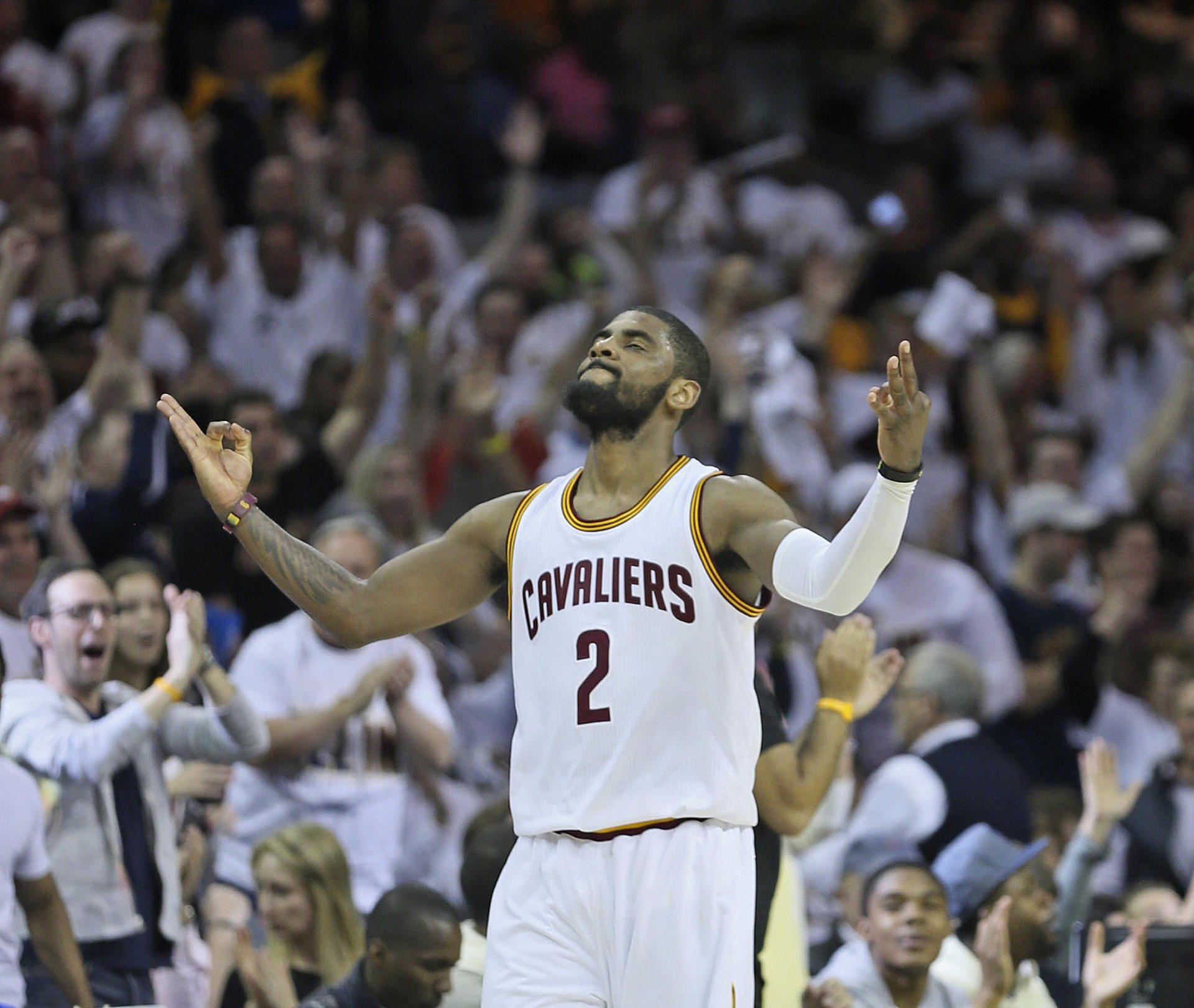 The Cavaliers' Kyrie Irving celebrates after he sinks a three-pointer against the Boston Celtics at Quicken Loans Arena. Irving scored 30 points for his team. Photo: TNS