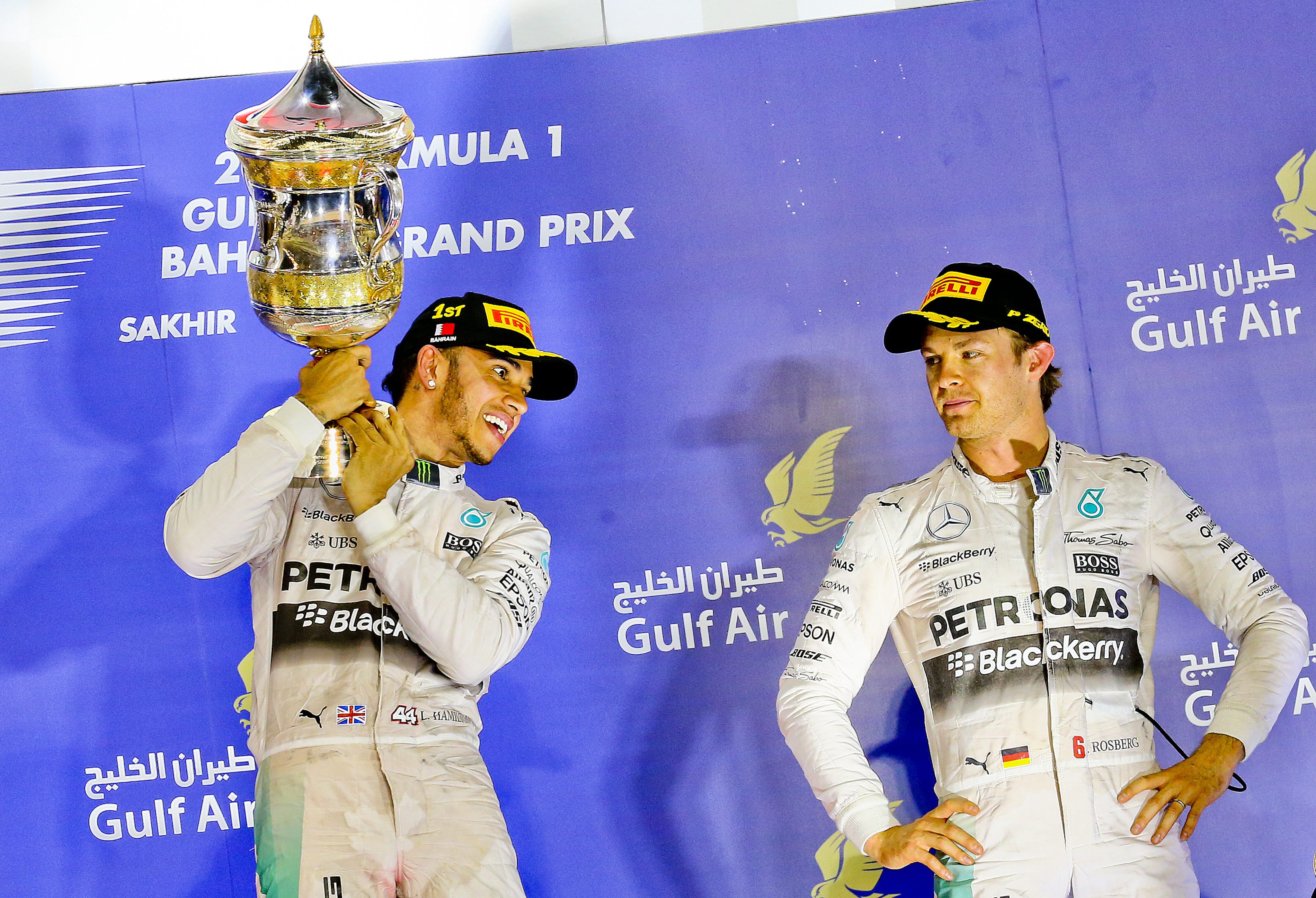 Lewis Hamilton of Mercedes celebrates his win next to third placed teammate Nico Rosberg following the Formula One Grand Prix of Bahrain at the Sakhir circuit near Manama. Photo: EPA