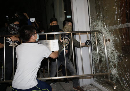 Occupy protesters broke windows at Legco in November. Photo: Reuters