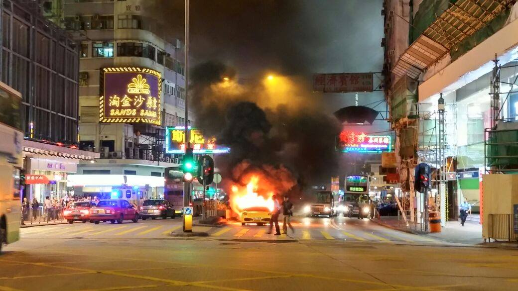 Chan's Ferrari on fire in TST on Wednesday evening. Photo: SCMP Pictures 