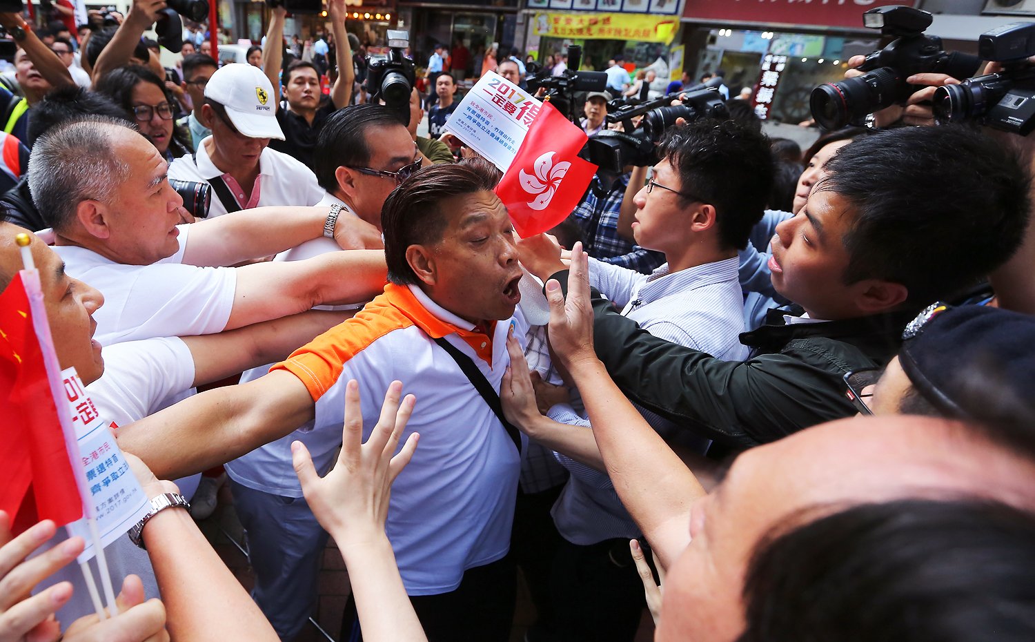 Supporters and opponents of the government 2017 electoral reform plans clash during the government promotion tour. Photo: Sam Tsang