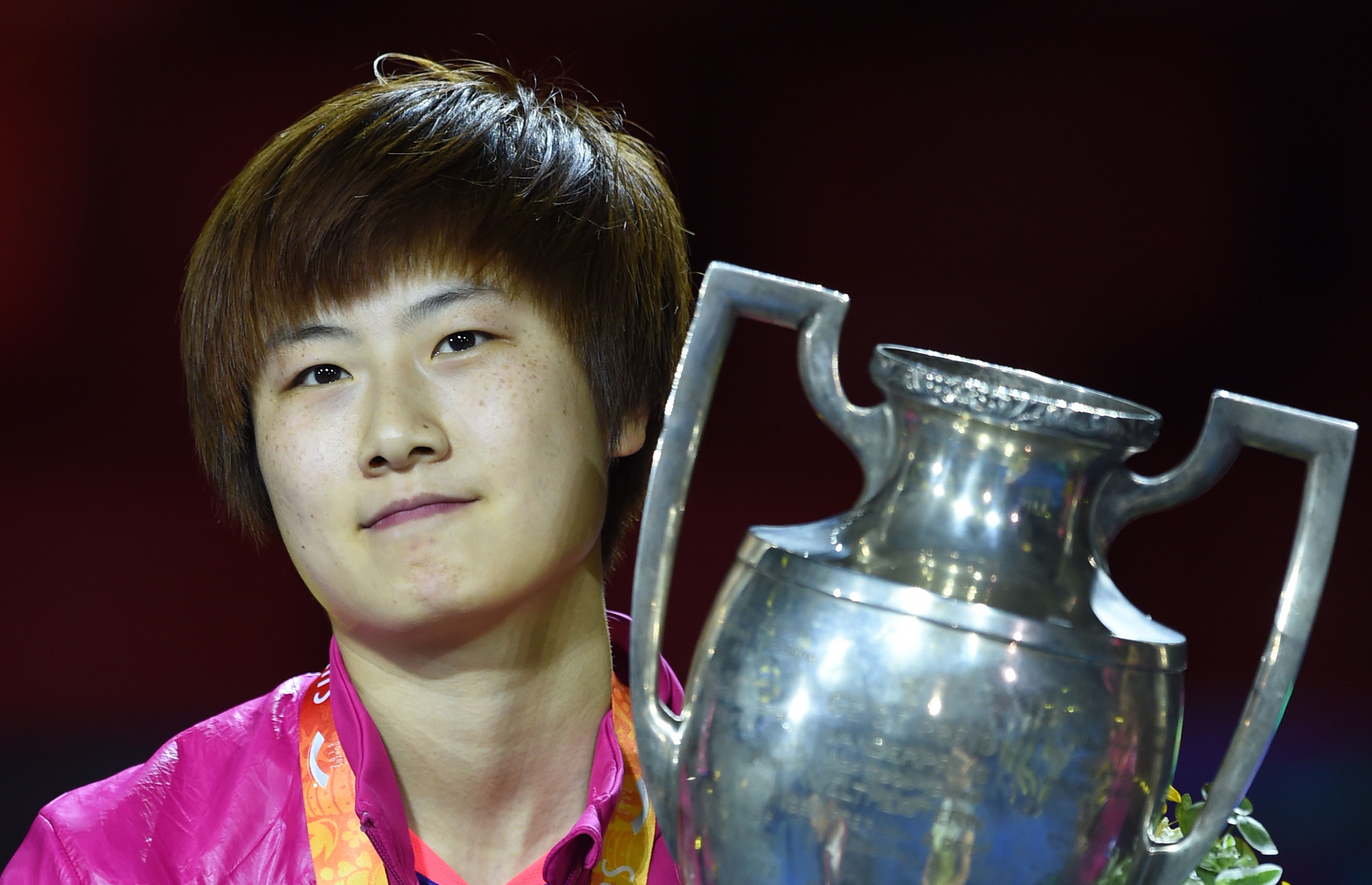Ding Ning of China poses with her trophy after winning the women's singles final against teammate Liu Shiwen at the World Table Tennis Championships in Suzhou. Photo: AFP
