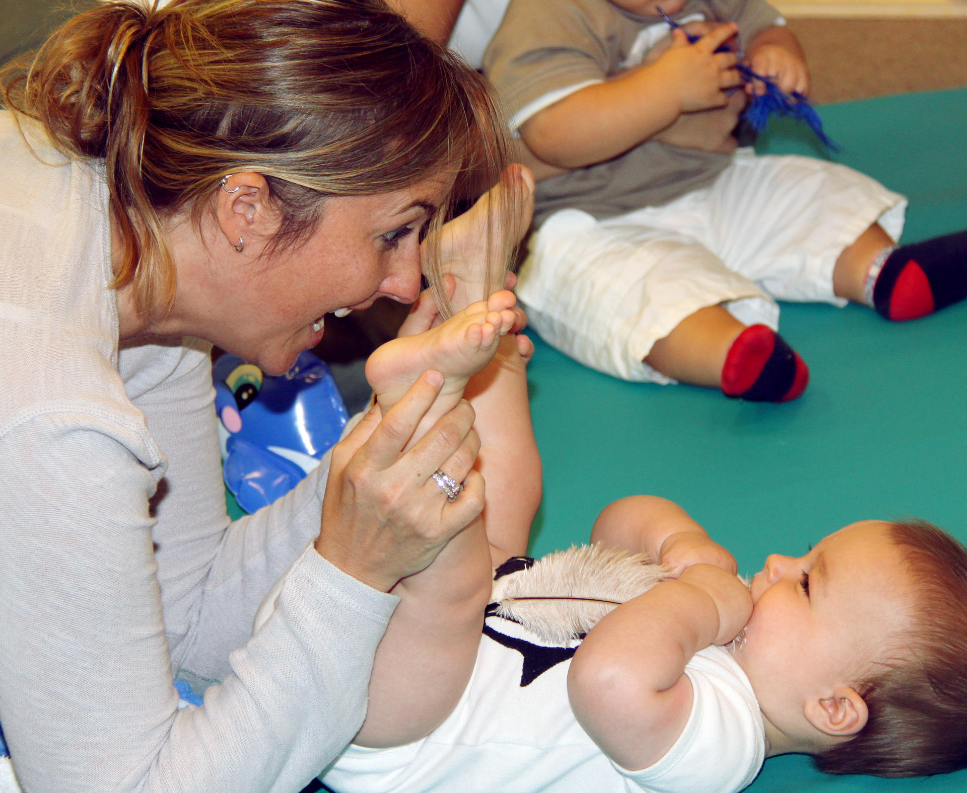 Fun with a feather at a Sensational Baby Class. Photo: Hazel Parry