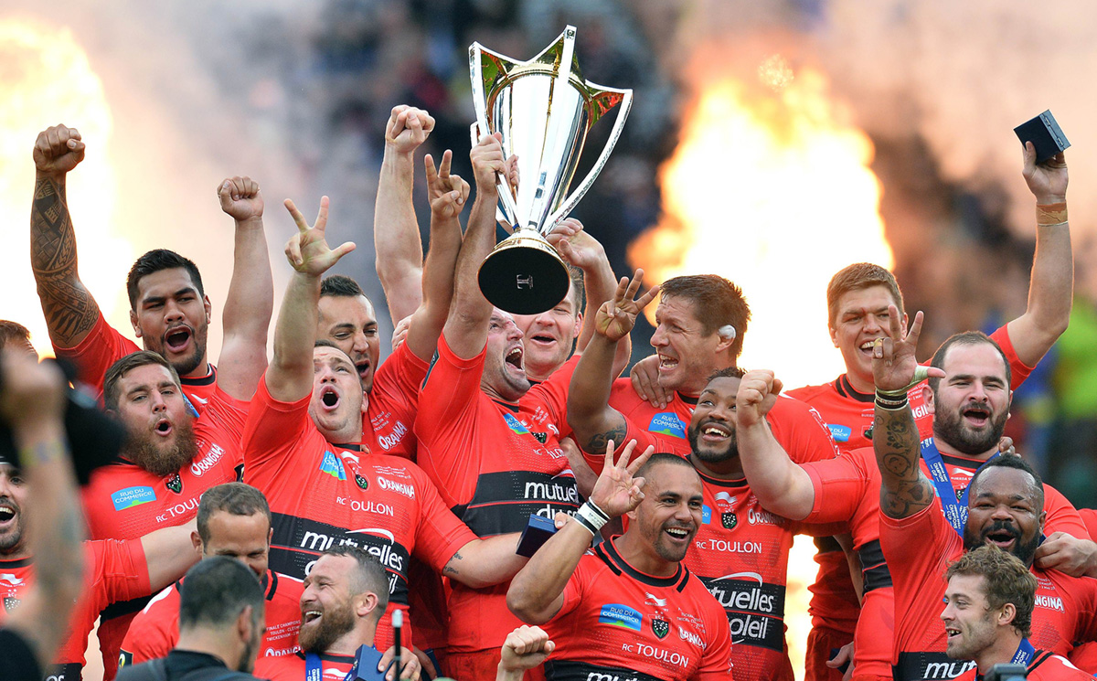 The triumphant Toulon players celebrate with the silverware after beating Clermont 24-18 on Saturday to capture their third successive European Rugby Champions Cup. Photos: AFP
