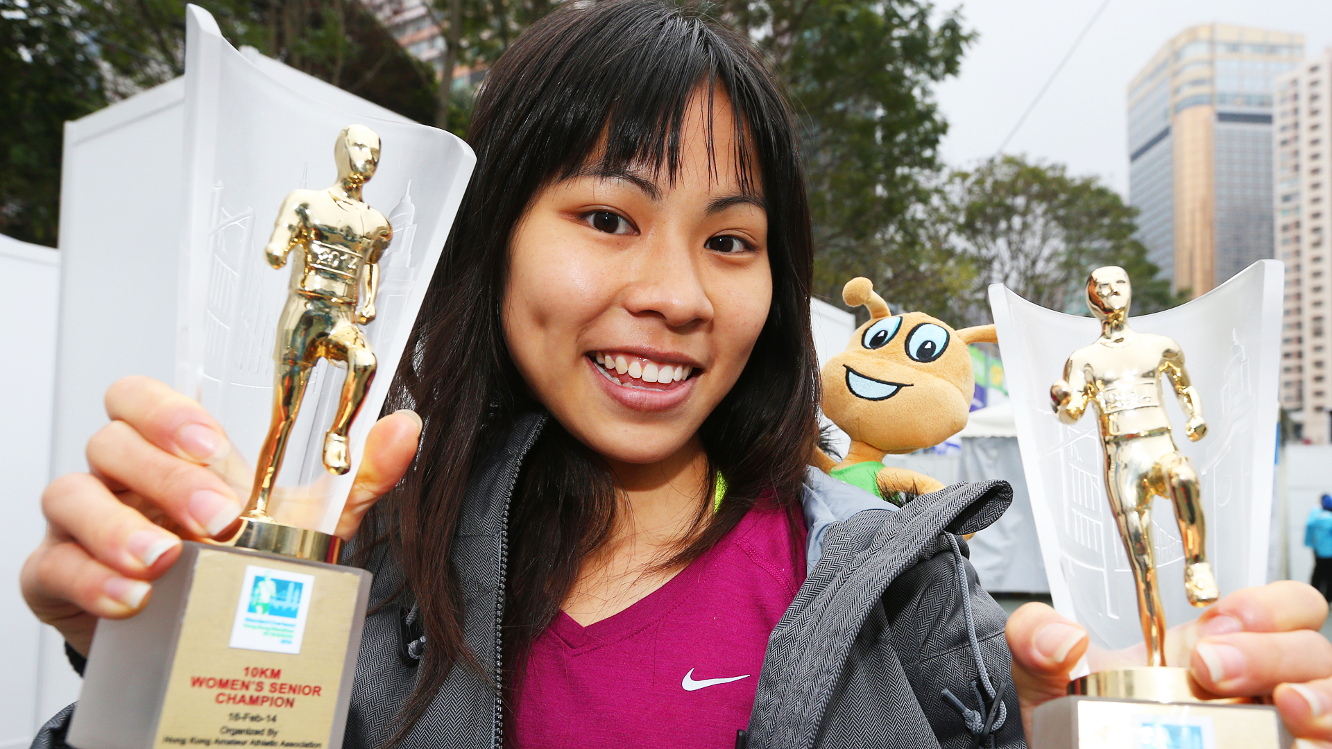 Christy Yiu with 10km and women's overall trophies from the Hong Kong Marathon last year. Photo: David Wong