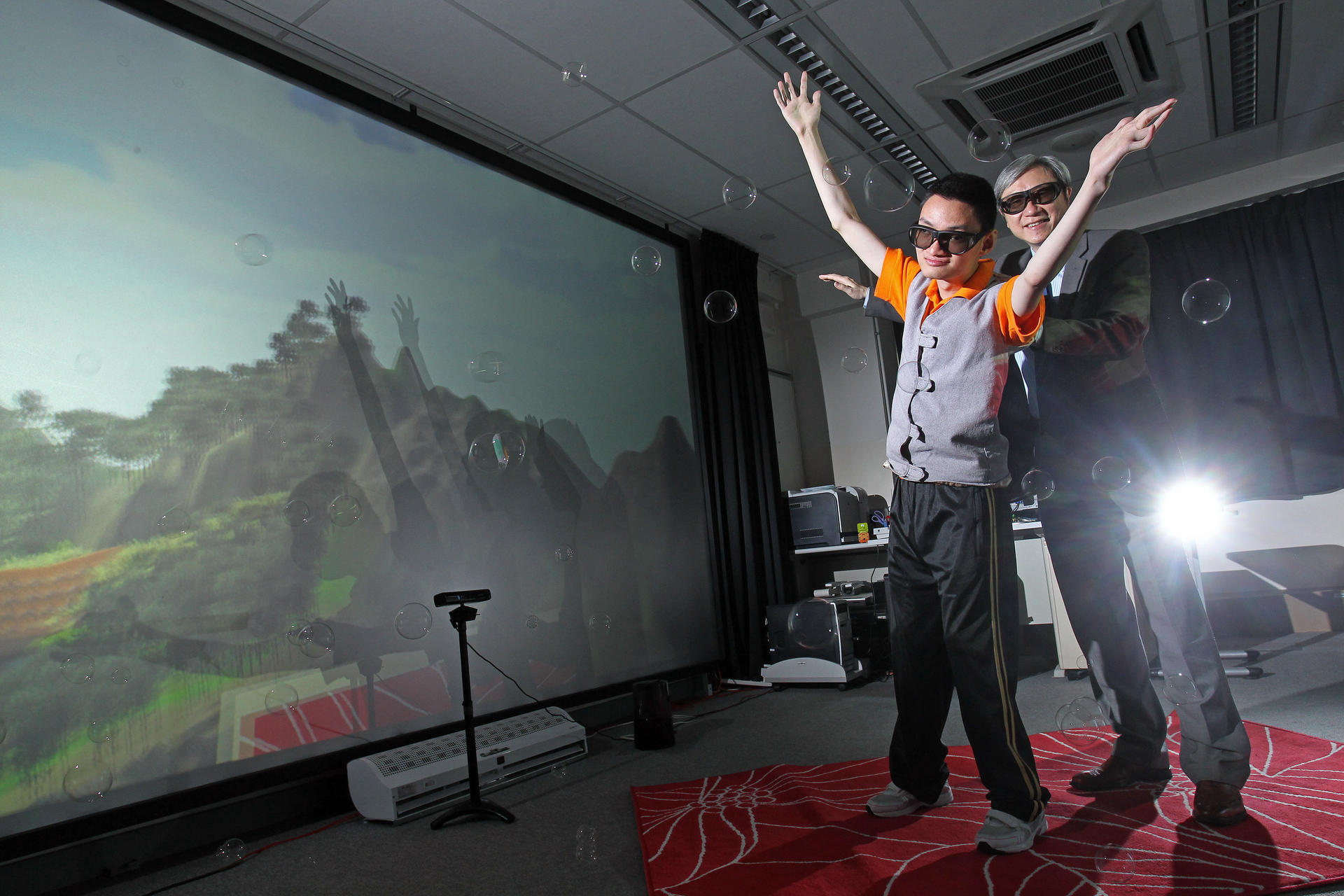 Man Wai-ho on the 3D flying carpet with Professor Ip. Photos: May Tse