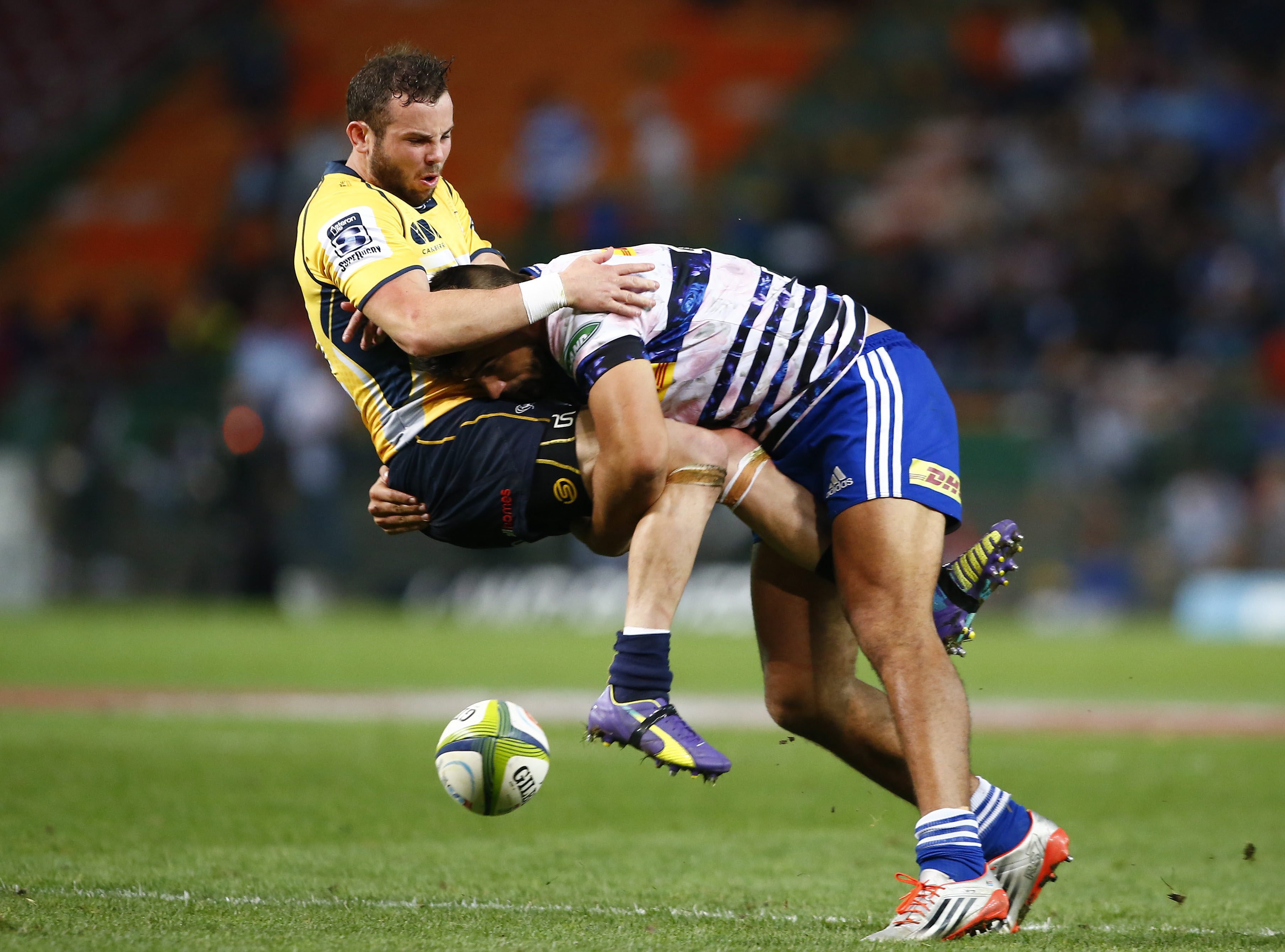 Damian de Allende of the Stormers (right) tackles Robbie Coleman of the Brumbies during their Super Rugby match at Newlands in Cape Town. Photos: EPA